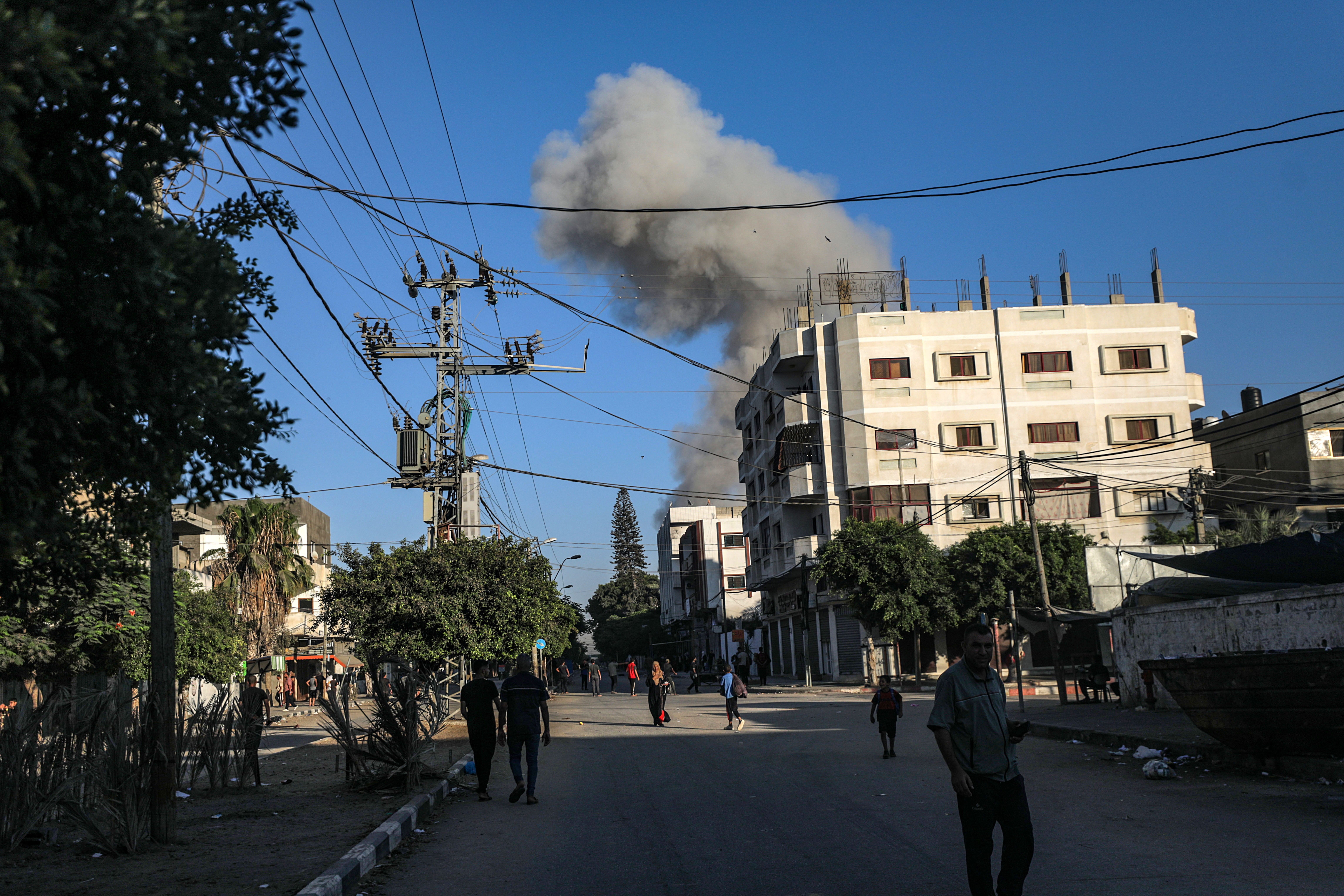 Smoke rises during an Israeli military operation in Deir Al Balah, central Gaza Strip, 25 August 2024