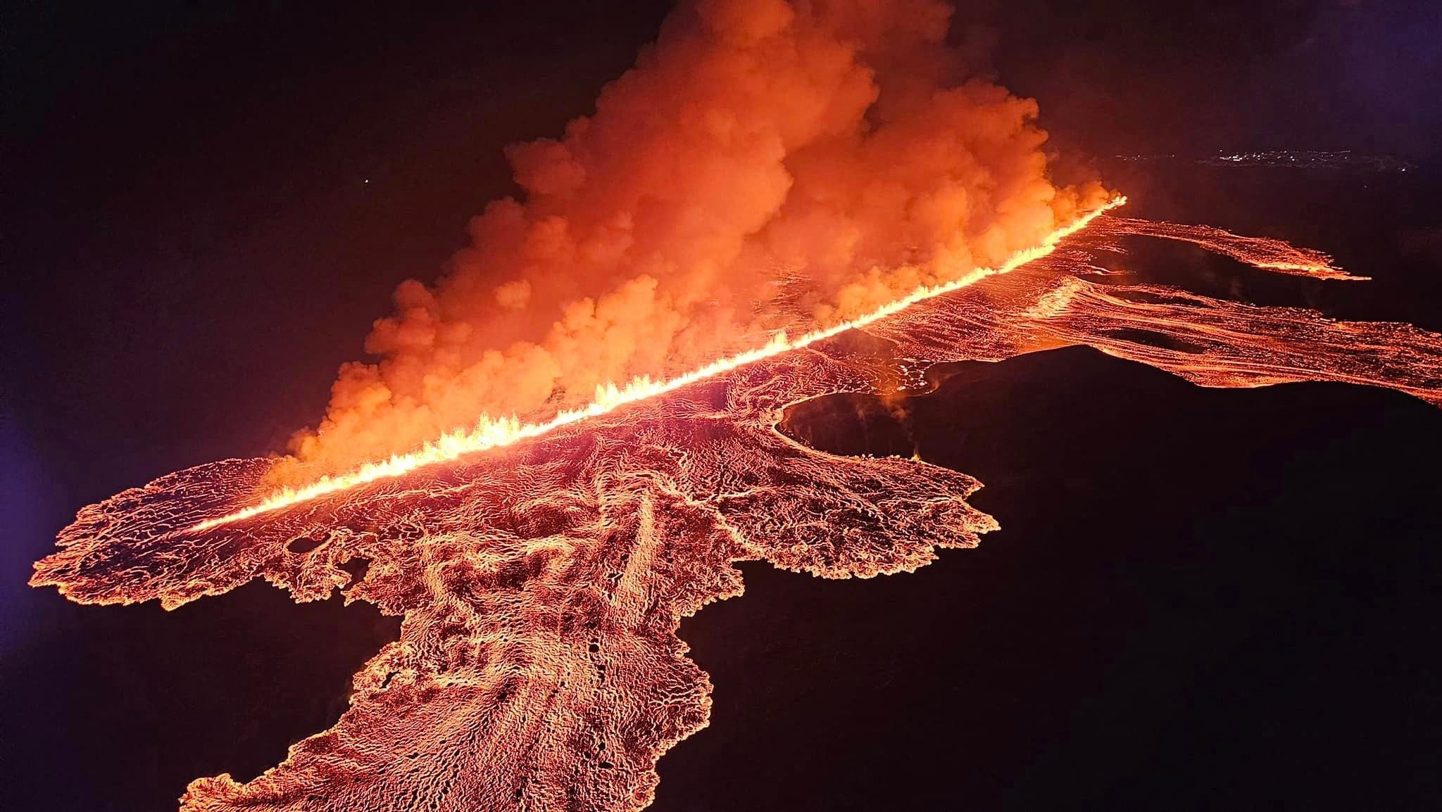 Handout picture released on 23 August by police in Iceland shows lava and smoke erupting from a volcano near Grindavik on the Reykjanes peninsula