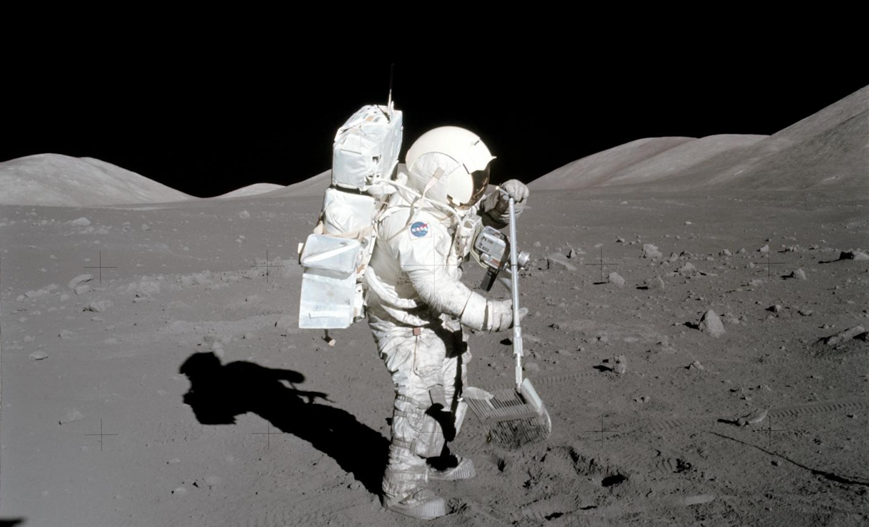 Apollo 17 astronaut Harrison Schmitt collecting samples of lunar soil