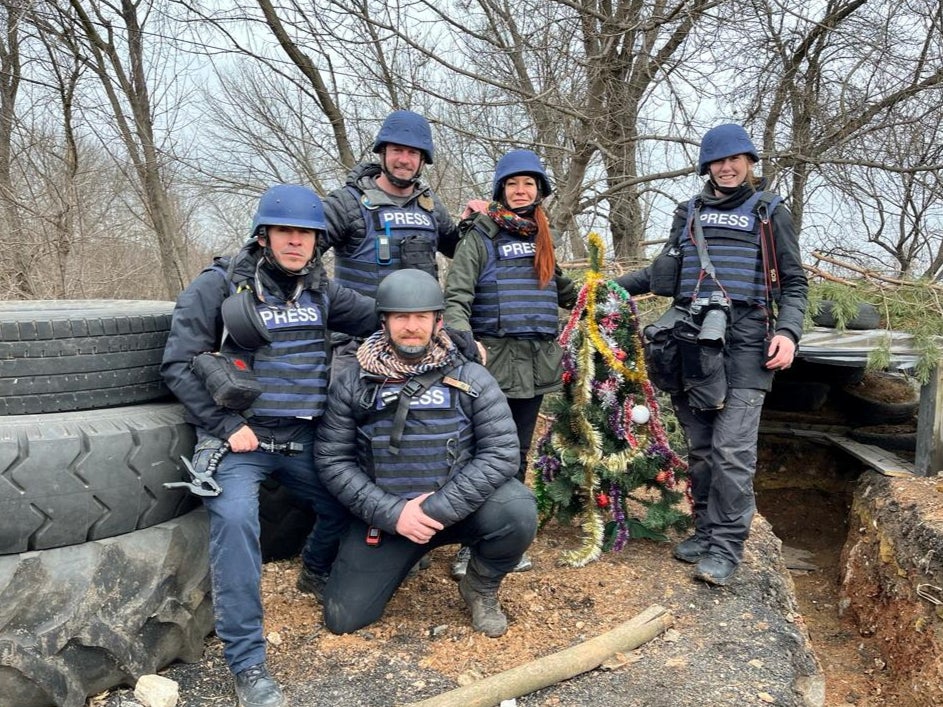 Reuters cameraman Herbert Villarraga, Reuters safety advisor Steve Kelly, Reuters safety advisor Ryan Evans, Reuters producer Asia Shtefan and Reuters photographer Clodagh Kilcoyne on Christmas eve during a news reporting assignment on the front line, in Bakhmut, Ukraine, 24 December 2022