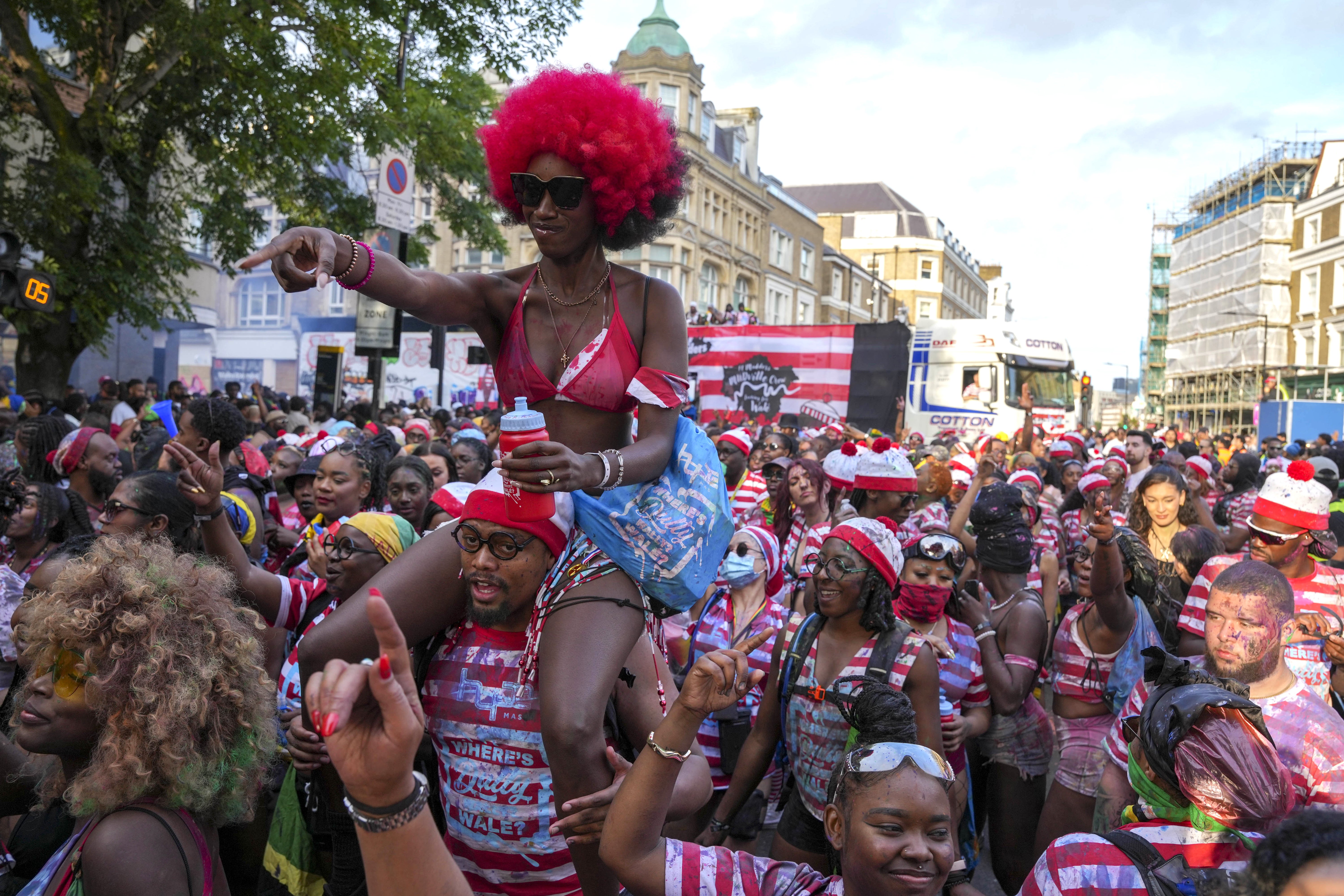 People attending the children's day parade, part of the Notting Hill Carnival celebration in west London, over the summer bank holiday weekend