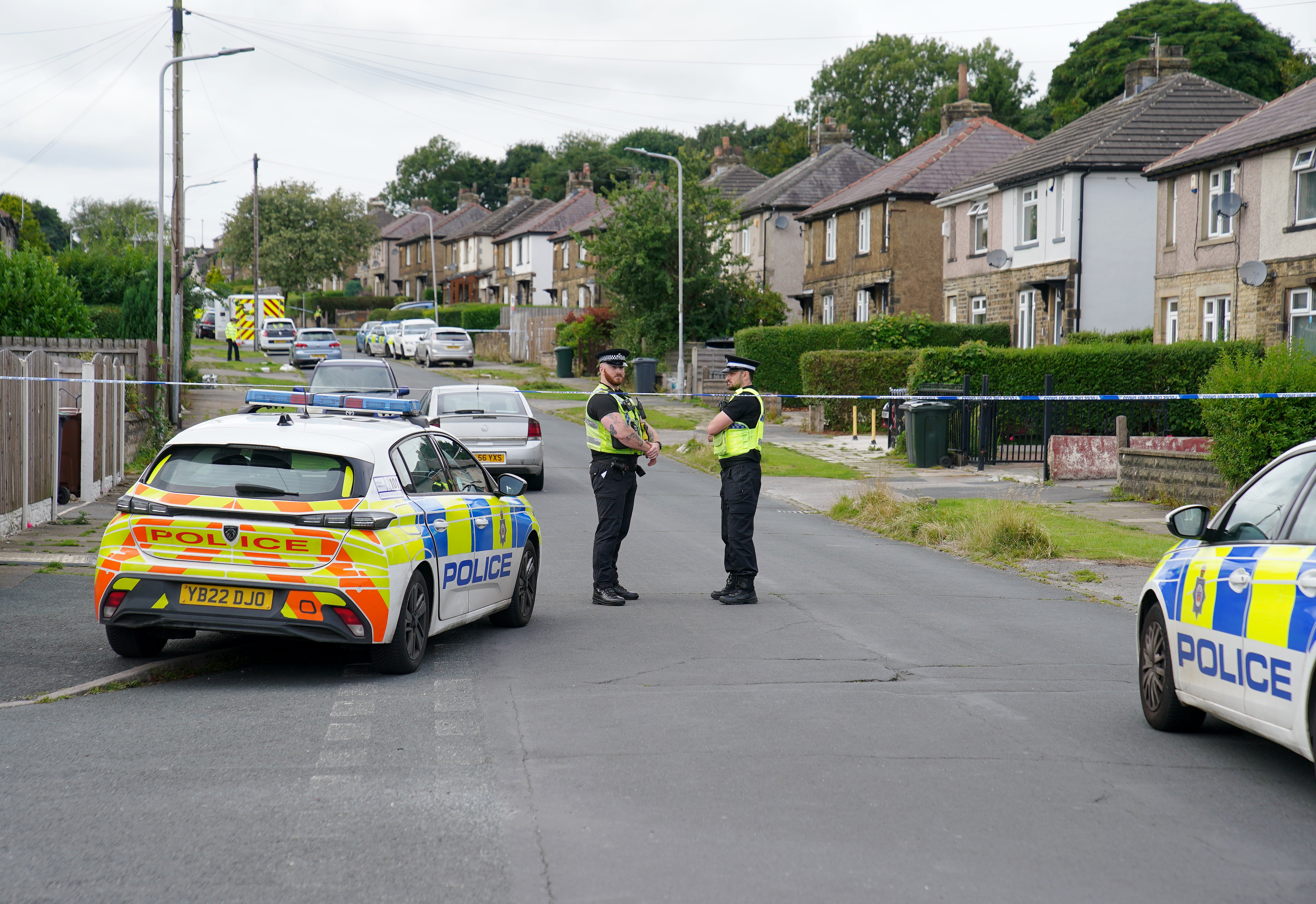 Emergency services in Westbury Road, Bradford, following the house fire