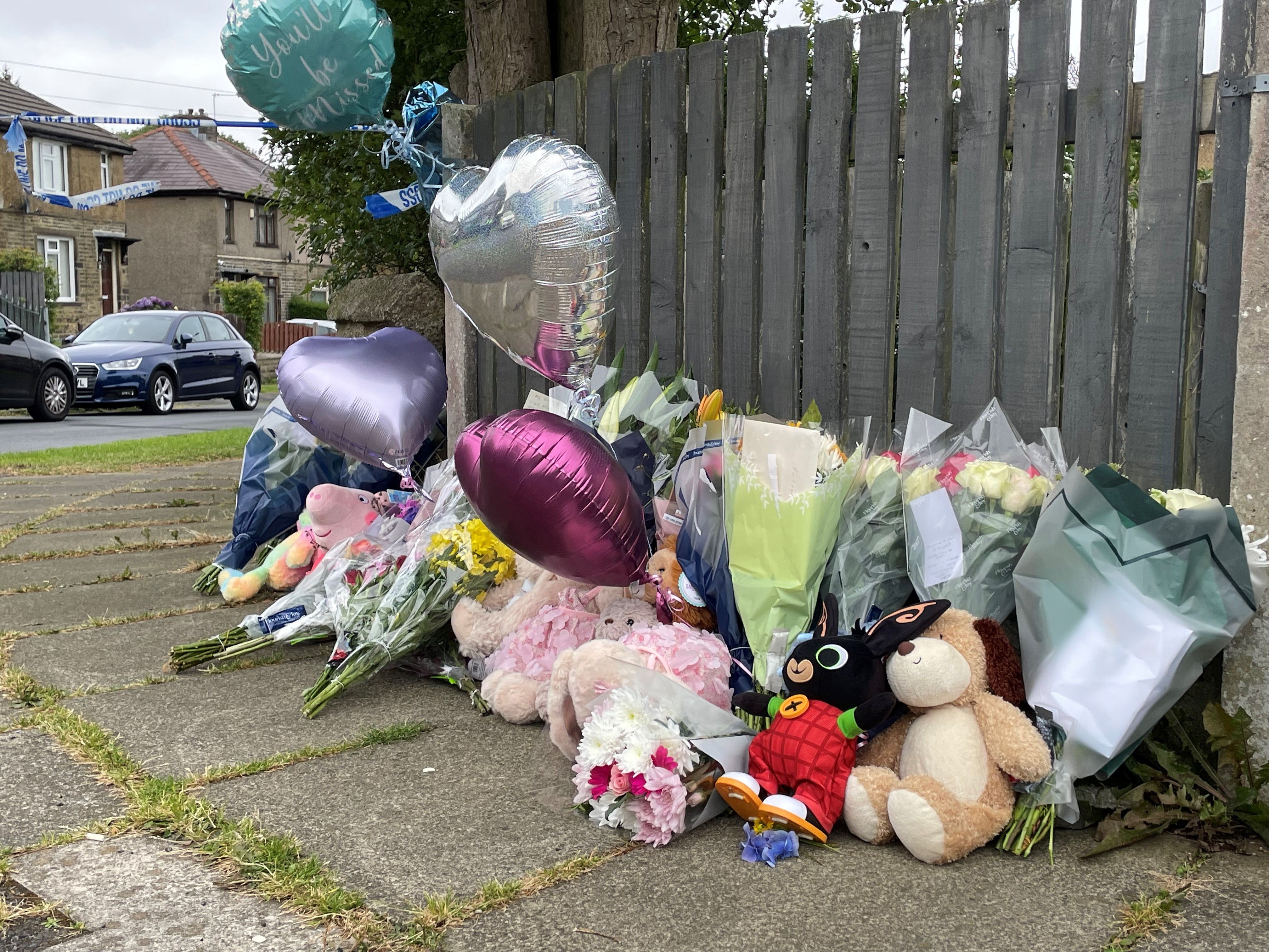 Flowers and tributes near the scene of the fatal house fire in Bradford