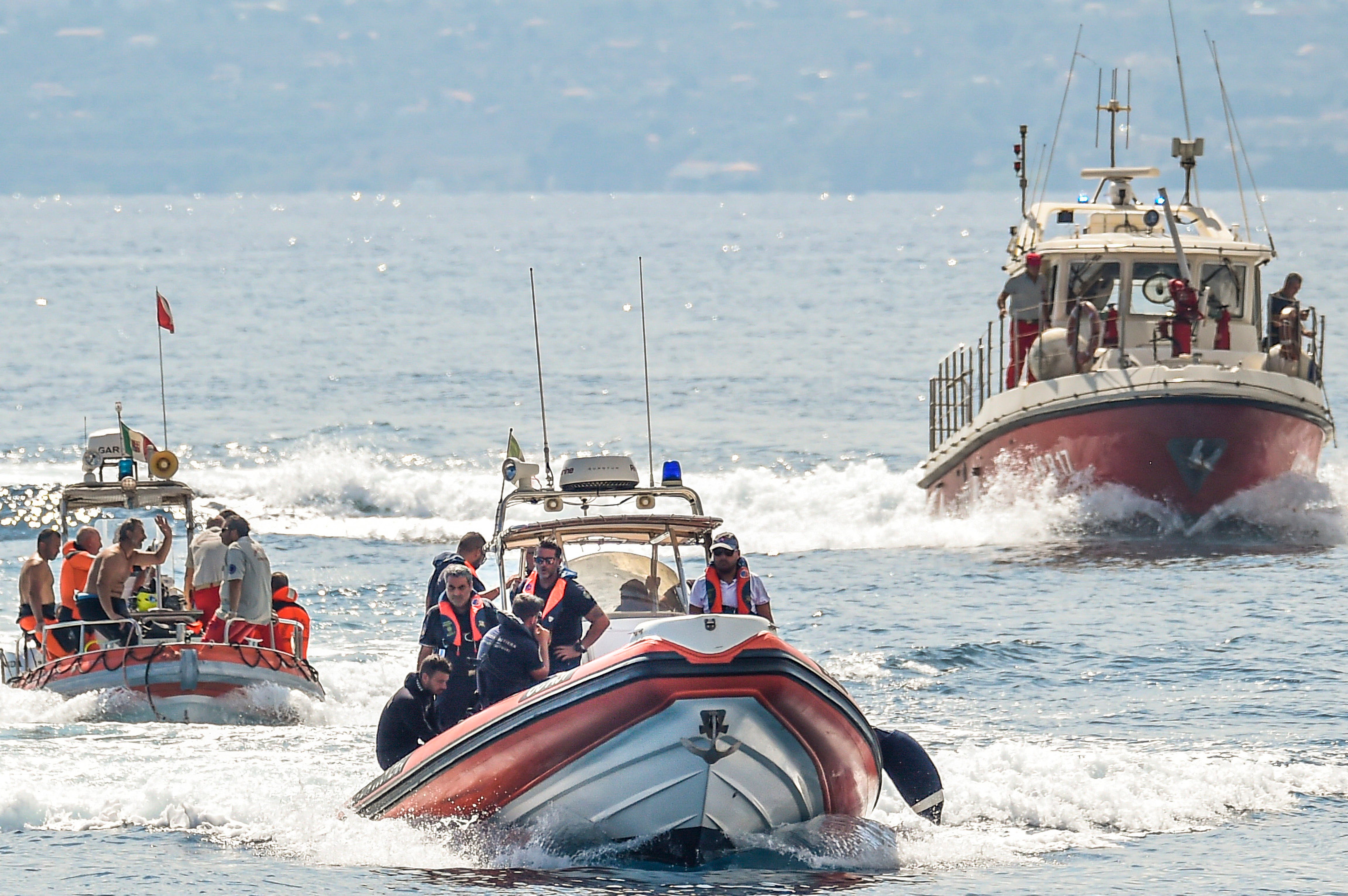 Italian divers working at the site of the shipwreck in Sicily on Thursday