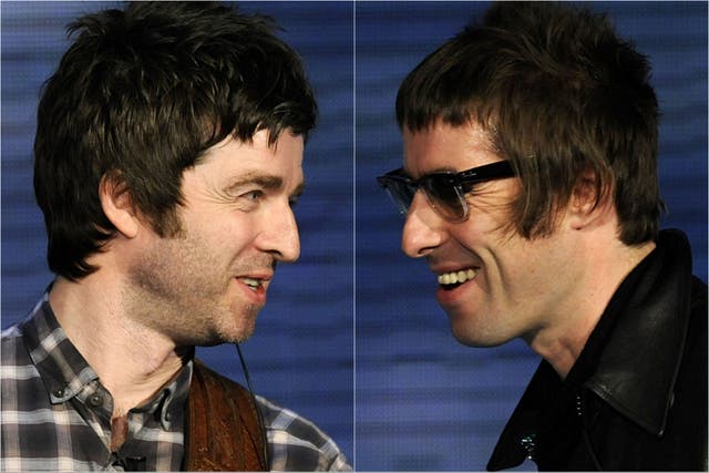 <p>Liam and Noel Gallagher performing with Oasis</p>