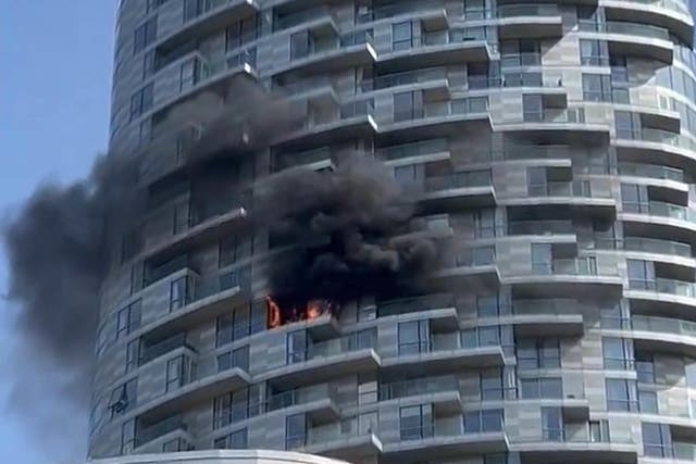 Handout photo taken with permission from the X feed of @JohnWickMG of the scene of a fire at a multi-storey tower block at New Providence Wharf in London (X/@JohnWickMG/PA)