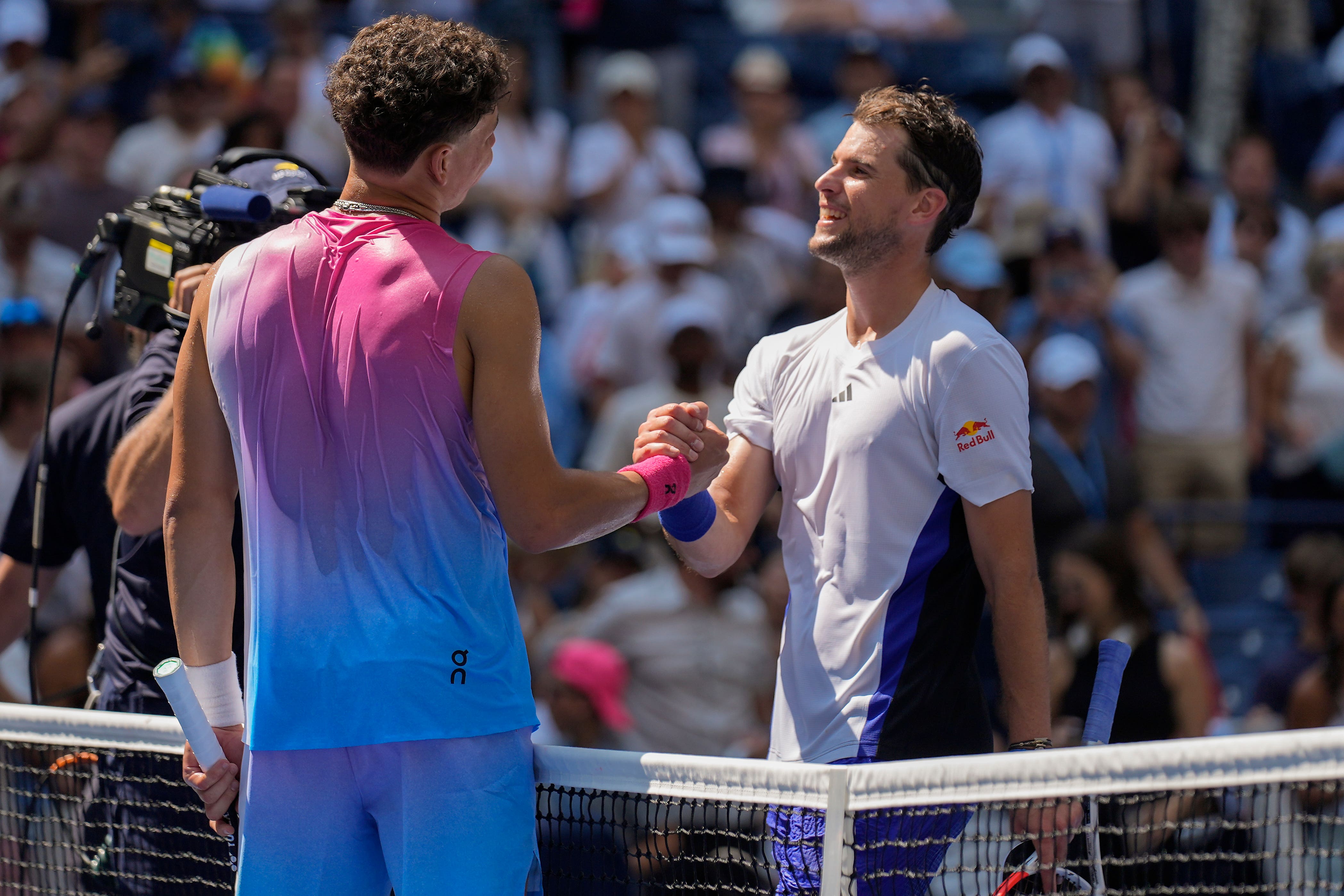 Dominic Thiem, right, was beaten in the first round by Ben Shelton (Seth Wenig/AP)