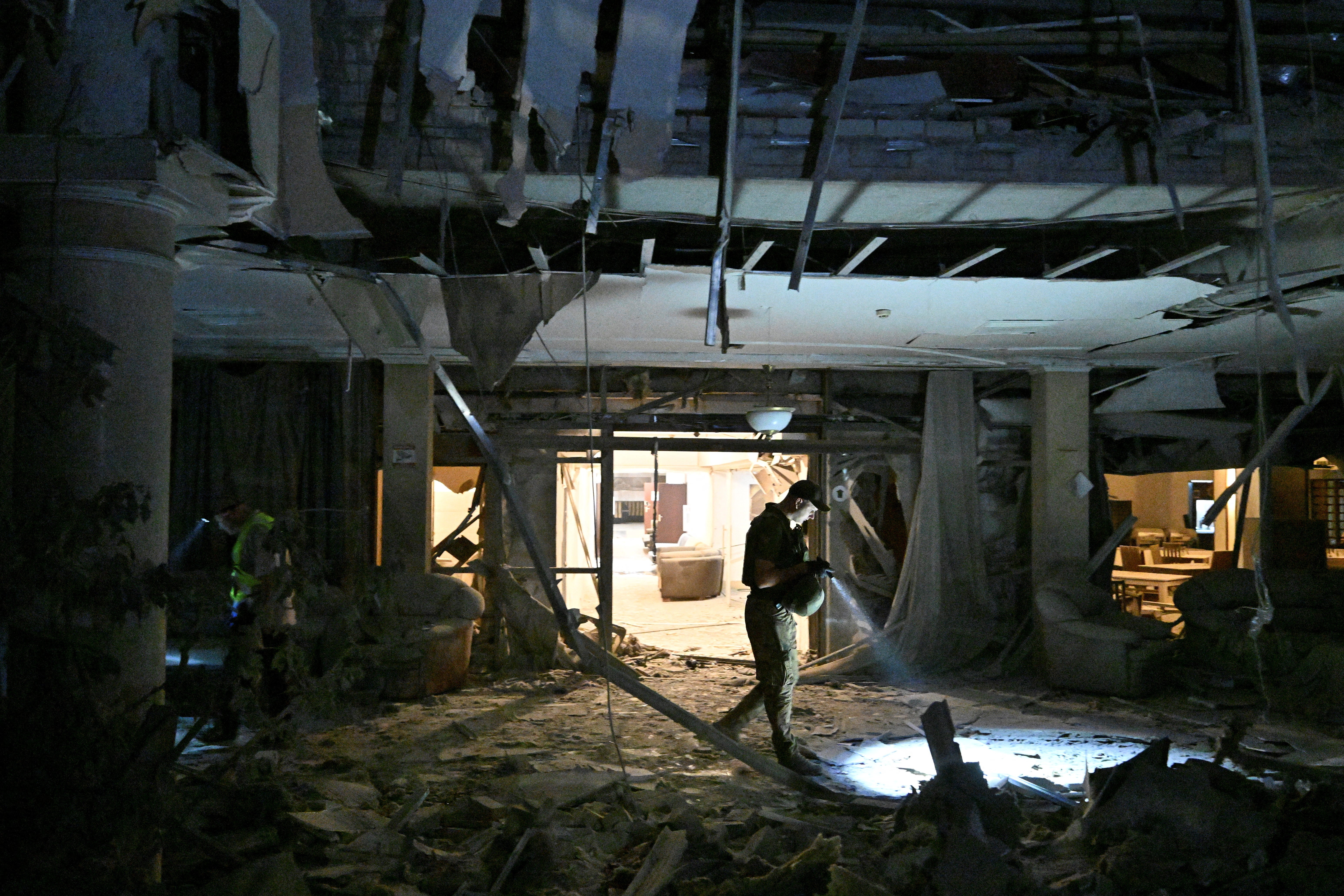 Police officers work at a site of a Russian missile strike, amid Russia’s attack on Ukraine, in Kryvyi Rih, Ukraine, 27 August 2024