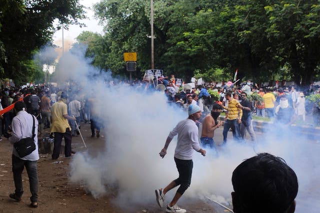 <p>Indian police use teargas during a protest against the rape and murder of a doctor at a hospital earlier this month in Kolkata city </p>