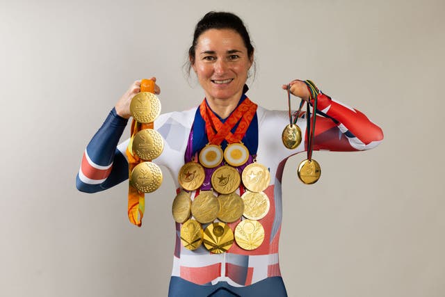 <p>Sarah Storey poses with her 17 Paralympic gold medals. She is the most successful British Paralympic athlete of all time with 28 medals including 8 silver and 3 bronze</p>