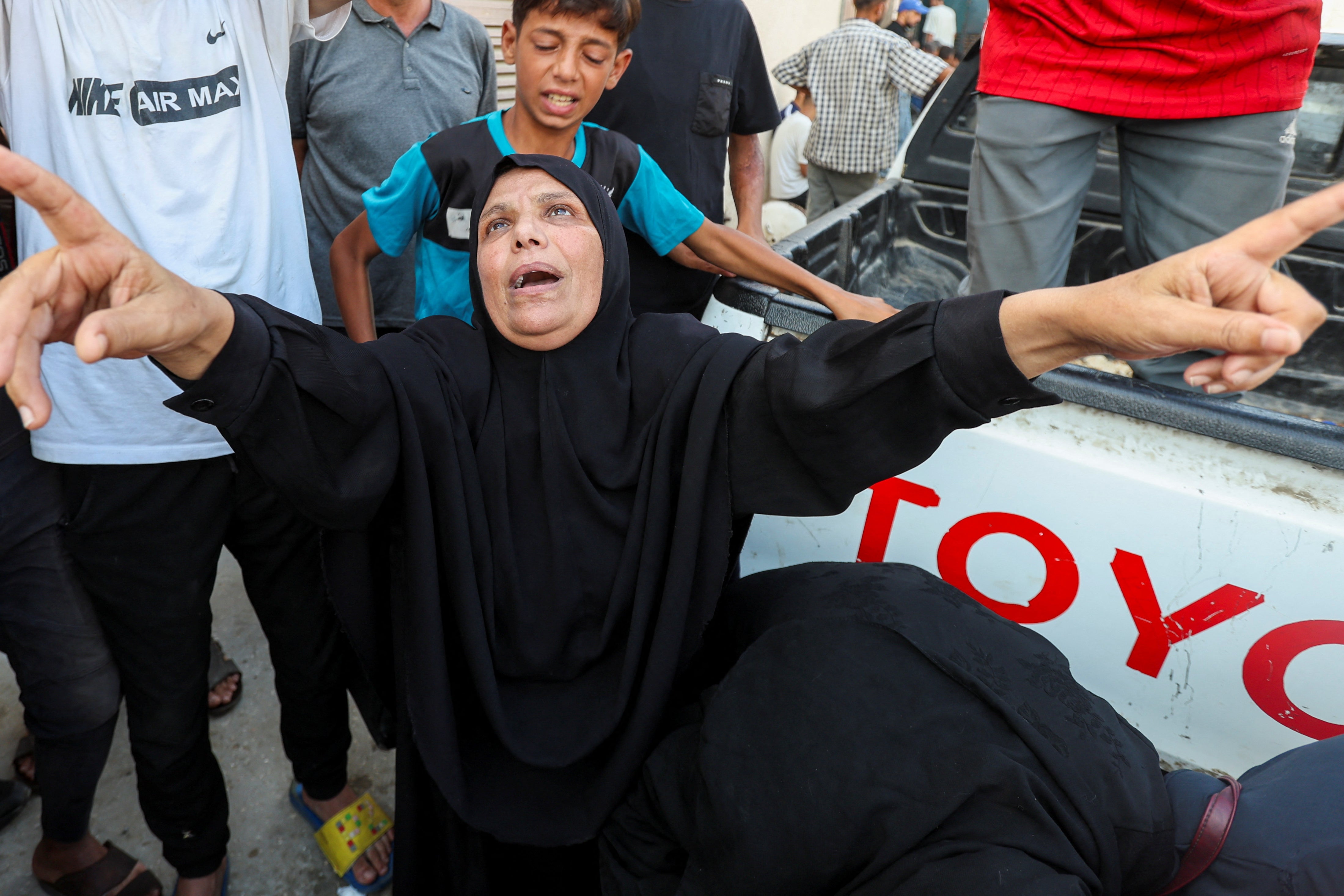 A mourner reacts during the funeral of Palestinians killed in Israeli strikes in Deir al-Balah