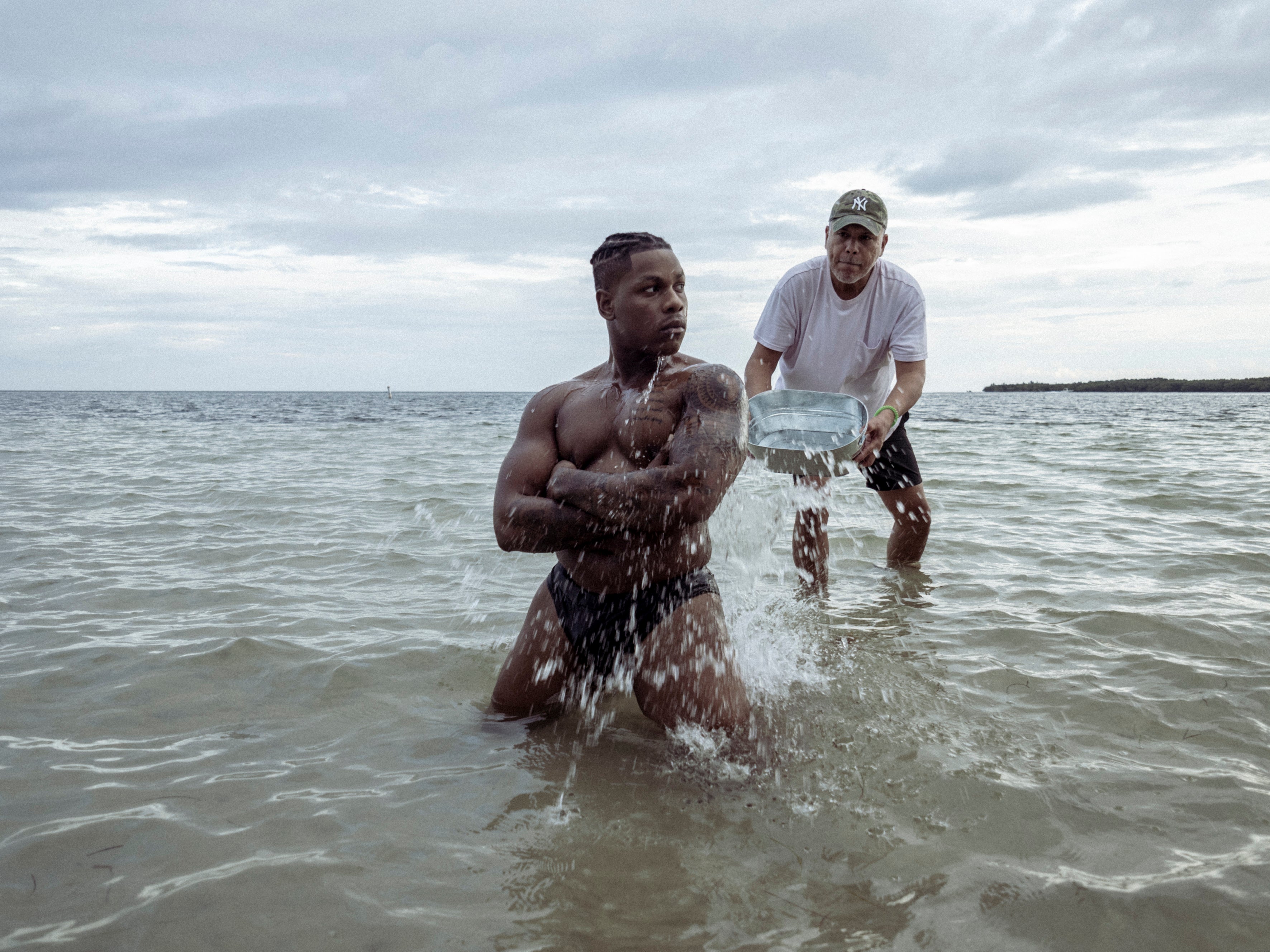 John Boyega strips down to his underwear in the water for his 2025 Pirelli Calendar photo shoot