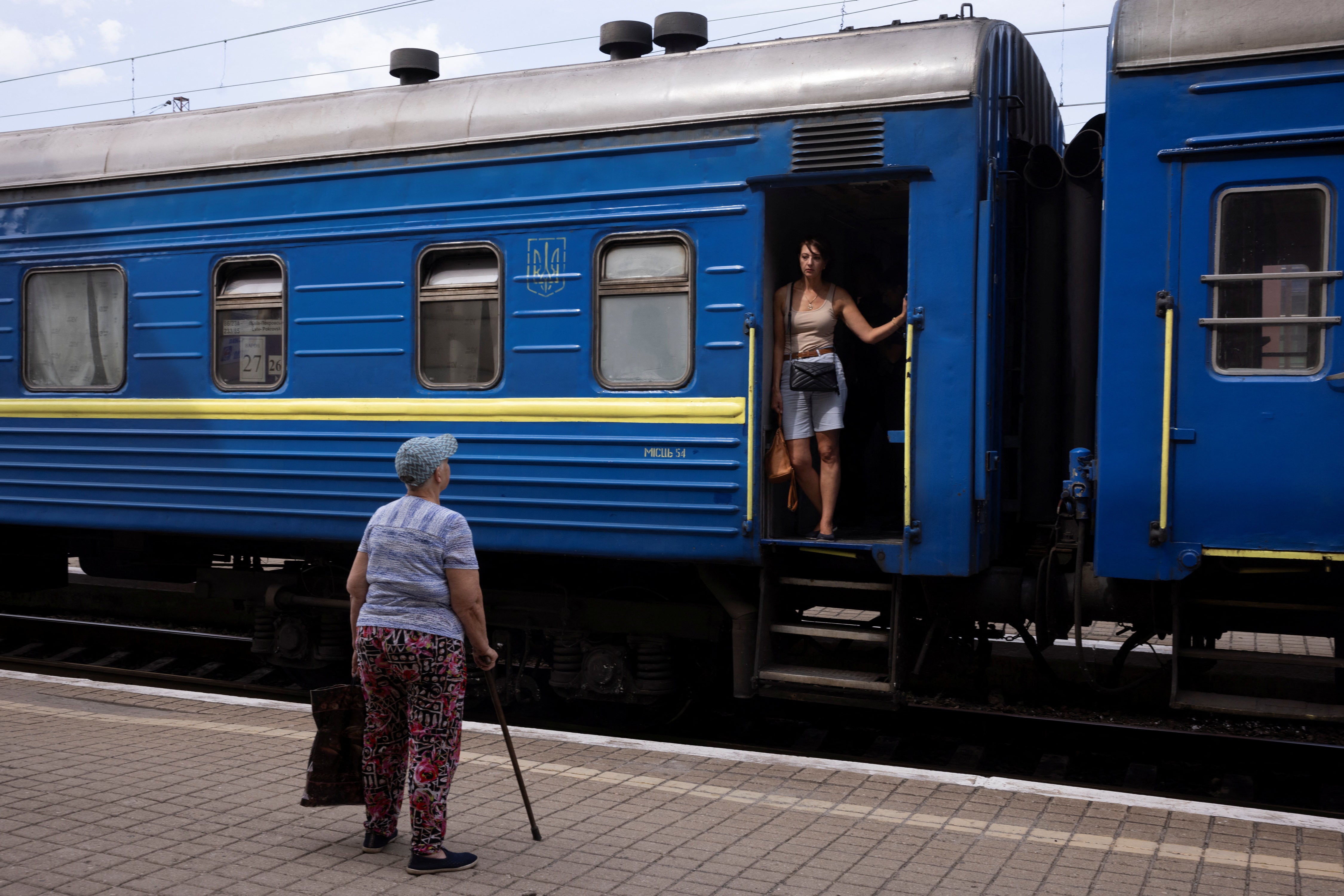 Pokrovsk resident Alexandra bids farewell to her daughter Natalia as she leaves on an evacuation train to flee from Russian troop advances in Pokrovsk