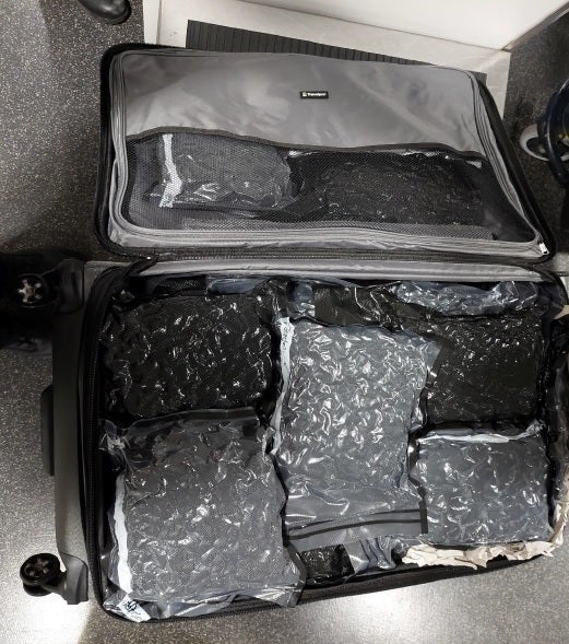 suitcases seized at Manchester Airport, filled with vacuum-packed cannabis, which 51-year-old Spanish national Fernando Mayans Fuster was found in possession of after flying in from LA in May