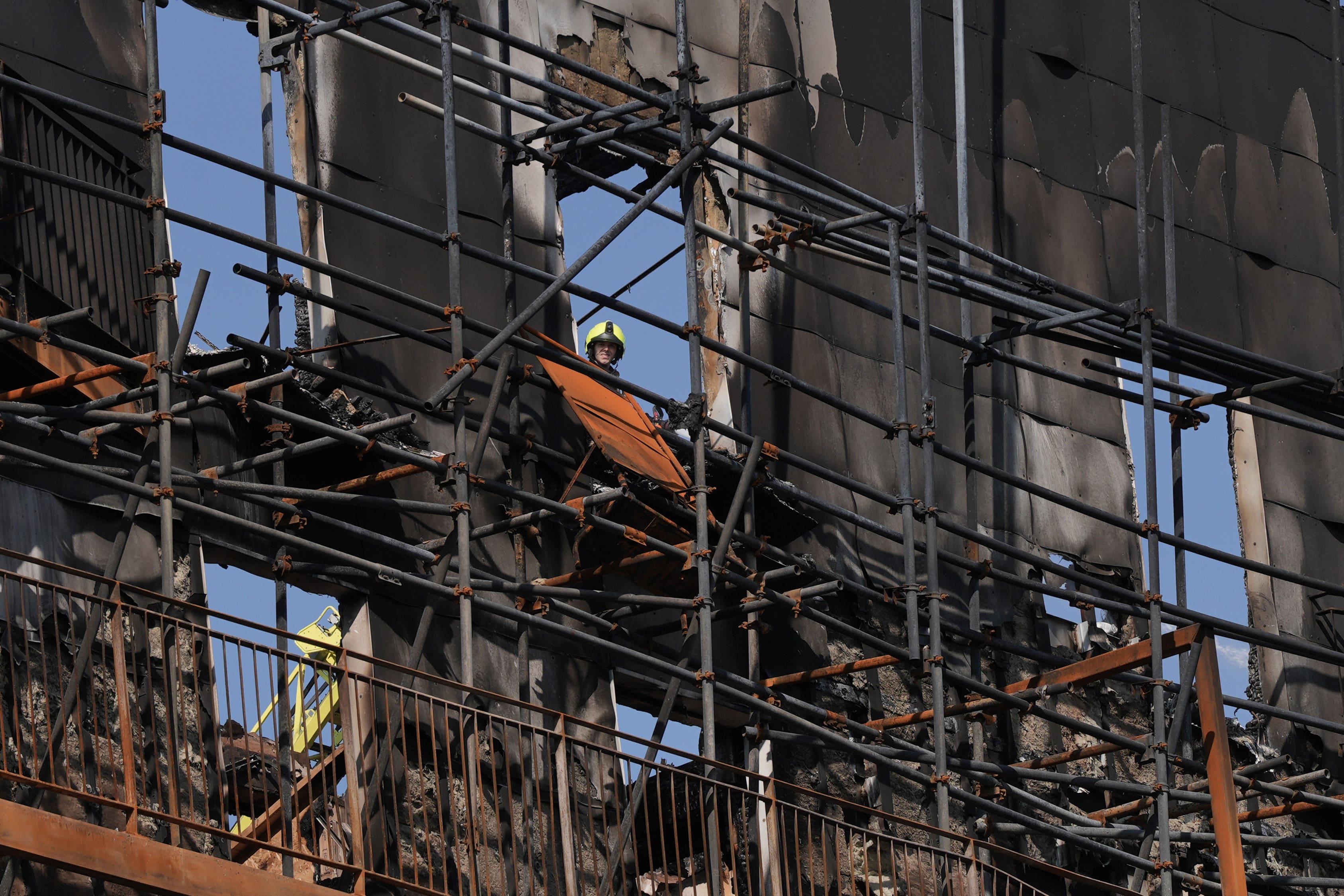 A firefighter at the scene in Dagenham, London, following a blaze at a block of flats (Stefan Rousseau/PA)