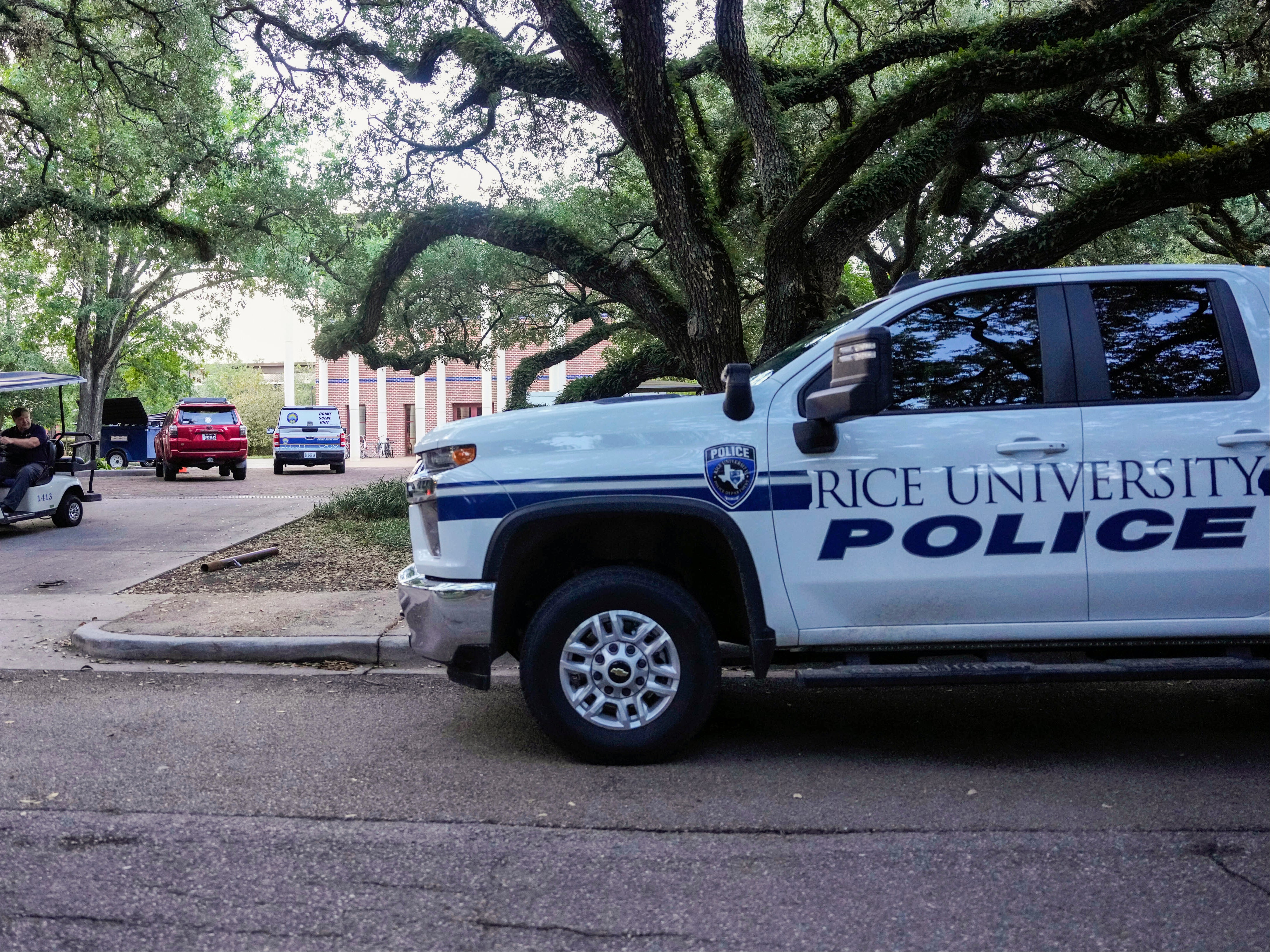 A Rice University Police vehicle sits parked after an apparent murder-suicide at Jones College, a residential college at Rice University\