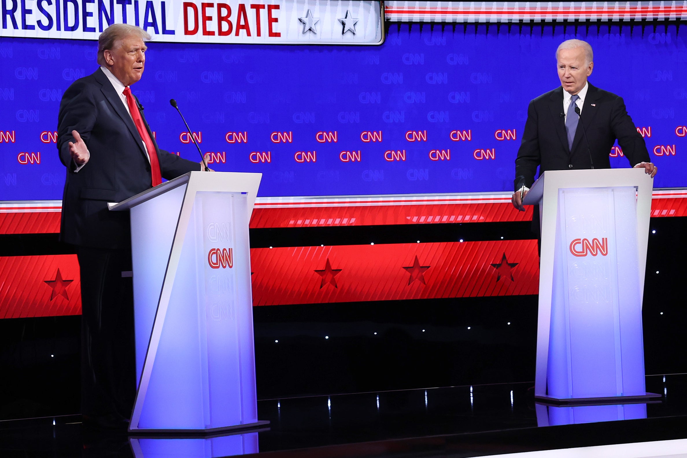 Joe Biden and Donald Trump participate in the CNN presidential debate at the CNN studios in Atlanta, Georgia on June 27, 2024. Trump sends a piece of his suit along with physical copies of his trading cards