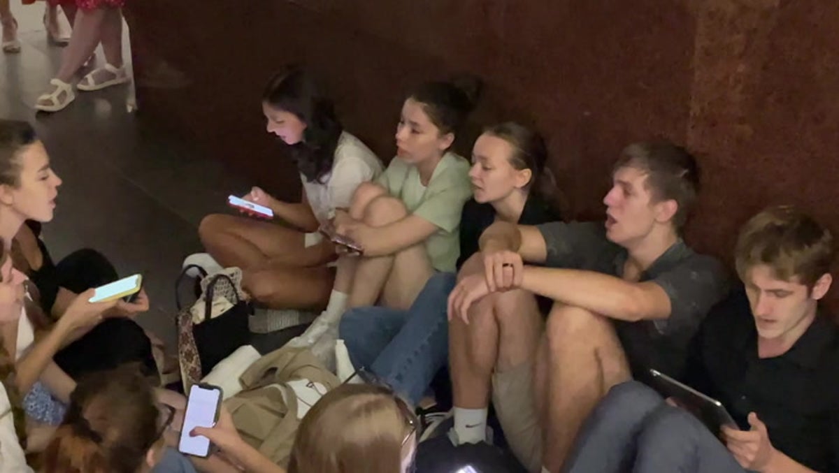 Kyiv residents sing city’s anthem while sheltering in subway during rocket attack