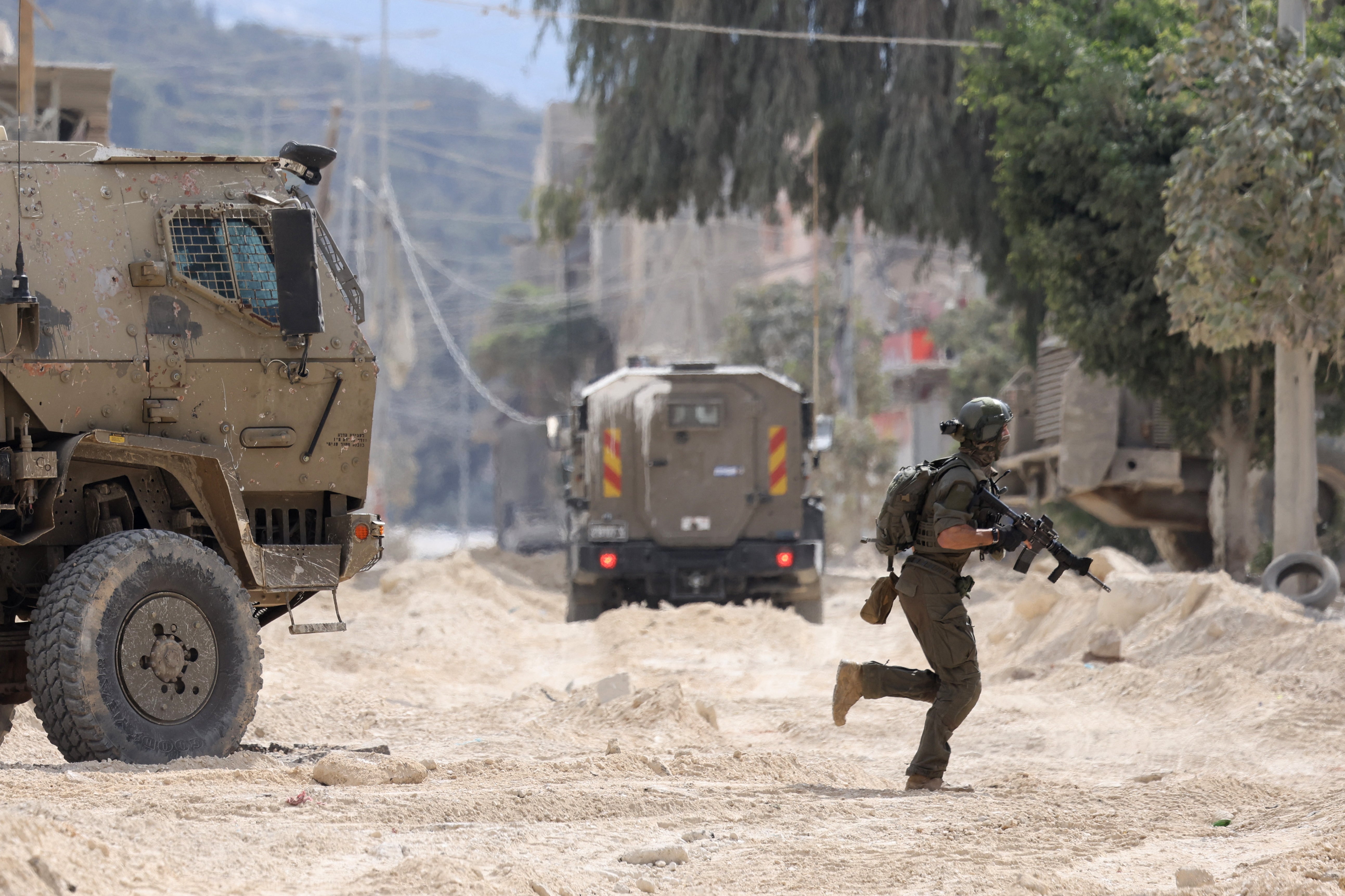 An Israeli soldier operates during a raid on the Nur Shams refugee camp early on Wednesday morning