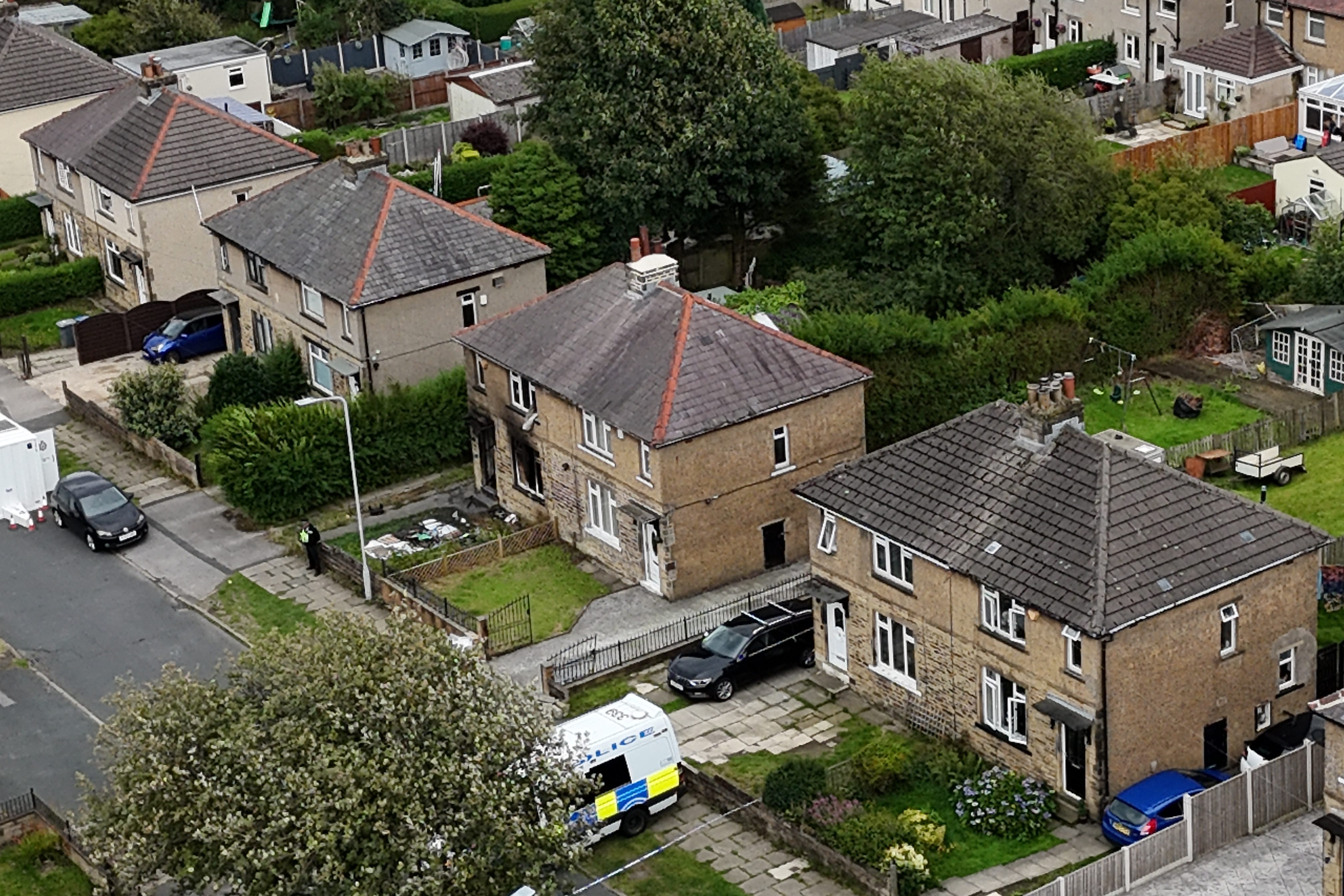 Emergency services in Westbury Road, Bradford, following a house fire (Peter Byrne/PA)