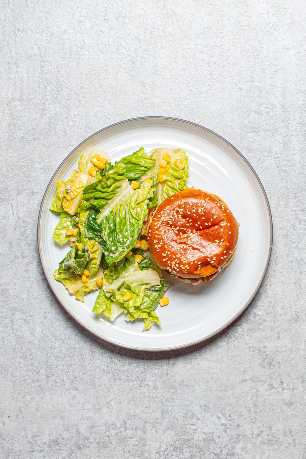 Juicy miso-infused salmon patties nestled in brioche buns, paired with a crisp little gem salad