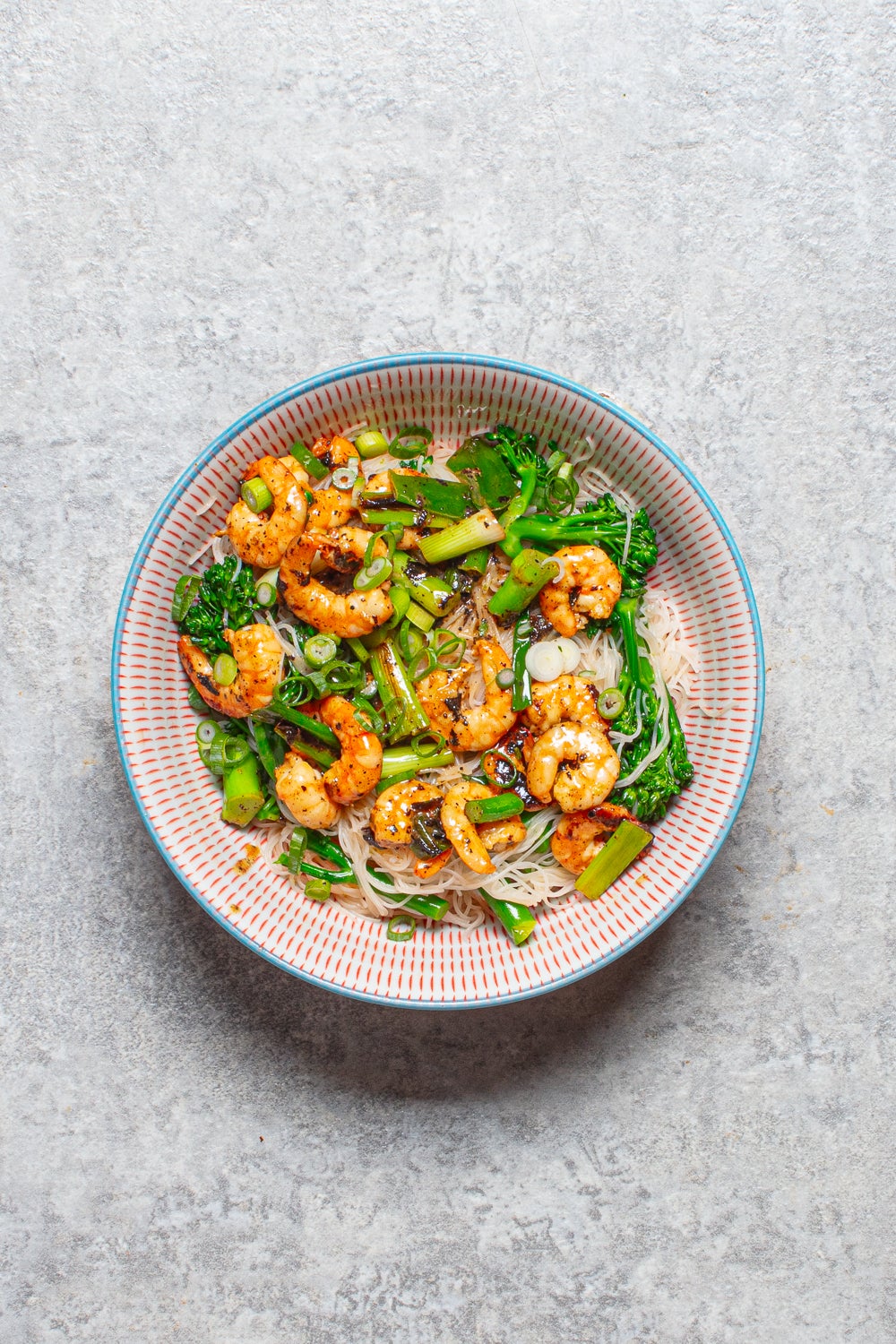 A zesty, fresh noodle salad with succulent prawns and tender broccoli, perfect for a light summer meal