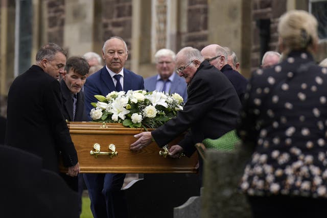 The coffin of country music star Derrick Mehaffey arrives at Donacavey Church of Ireland Parish Church in Fintona (Niall Carson/PA)