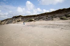 Two boys die after being buried in sand while digging hole on beach in Denmark