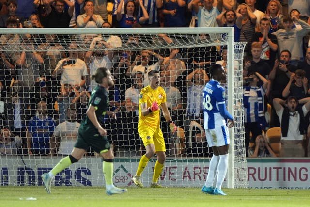 Brentford goalkeeper Hakon Valdimarsson (centre) reacts after saving a penalty (Joe Giddens/PA)