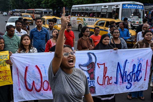 <p>Activists shout slogans and display a banner during a protest rally to condemn the rape and murder of a doctor in India’s West Bengal state, in Kolkata on 25 August 2024</p>