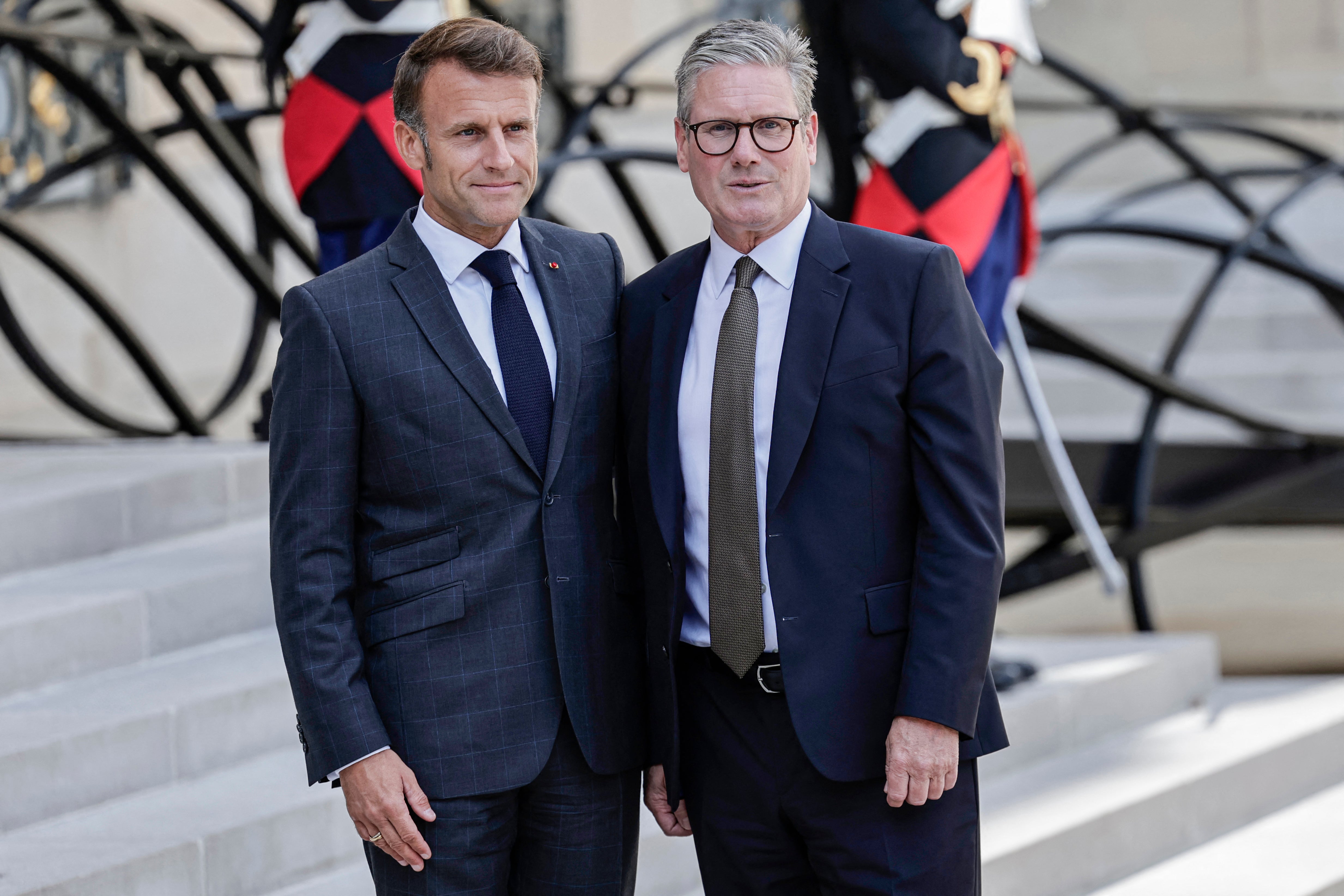 France's President Emmanuel Macron (L) and Britain's Prime Minister Keir Starmer pose prior to a meeting at the Elysee presidential palace in Paris