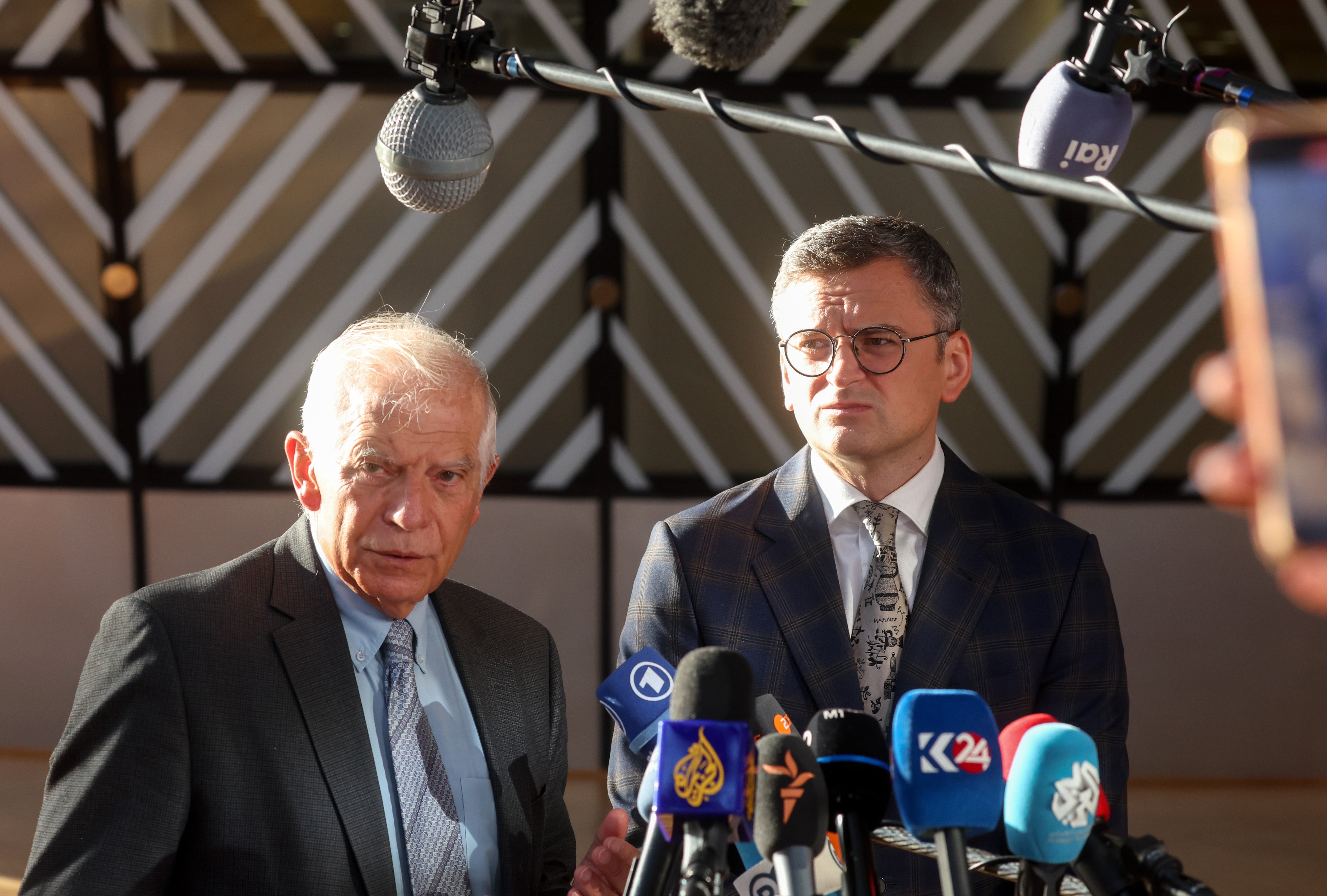 EU foreign policy chief Josep Borrell (L), and Ukrainian Foreign Minister Dmytro Kuleba speak to the press ahead of an informal meeting of European Foreign Affairs Ministers in Brussels