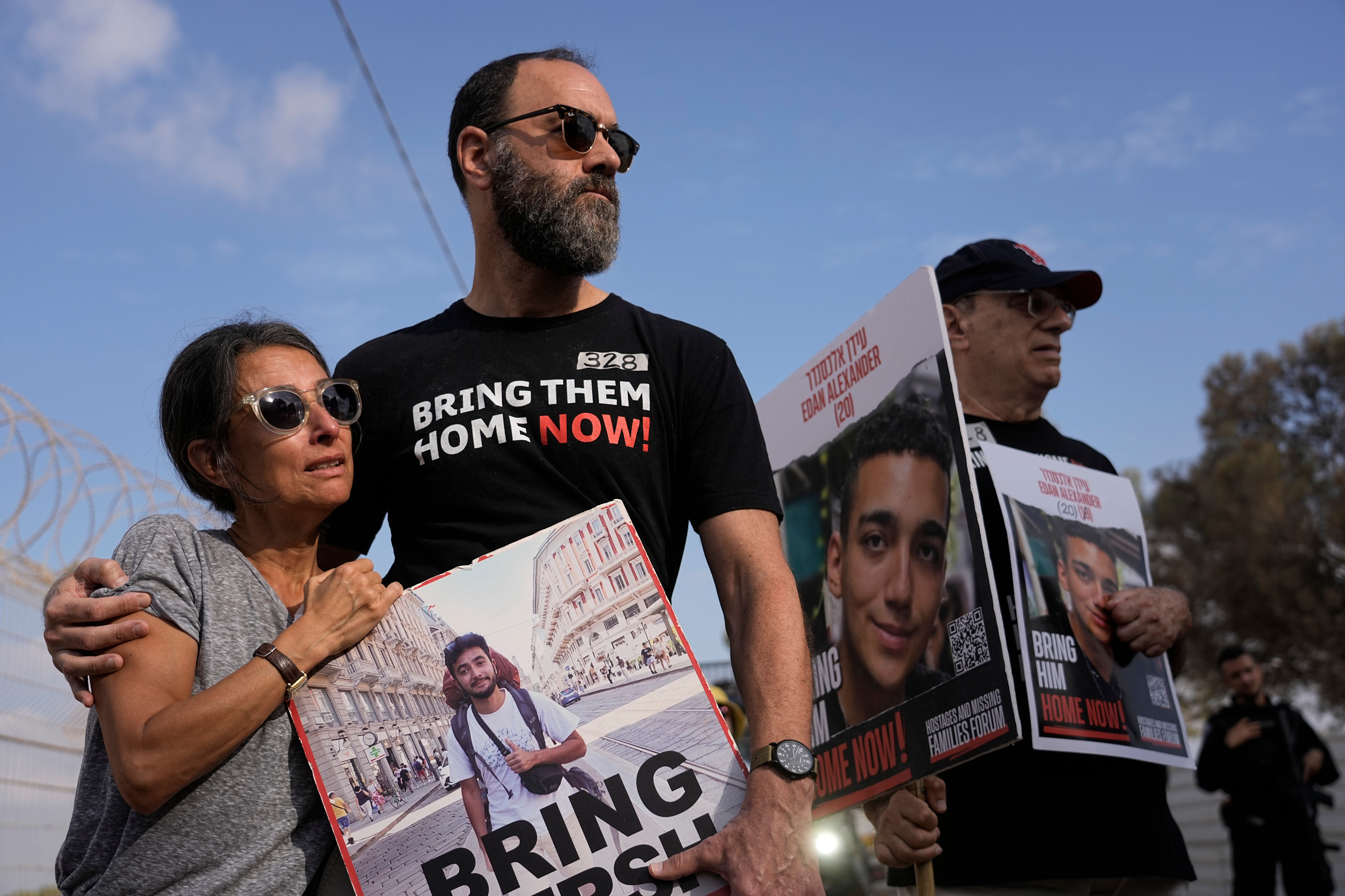 Rachel Goldberg, left, and Jon Polin center, parents of Israeli-American hostage Hersh Polin-Goldberg, along with other relatives of hostages held in the Gaza Strip by the Hamas militant group take part in a protest calling for their release in the Kibbutz Nirim, southern Israel, Thursday, 29 Aug 2024. (AP Photo/Tsafrir Abayov)