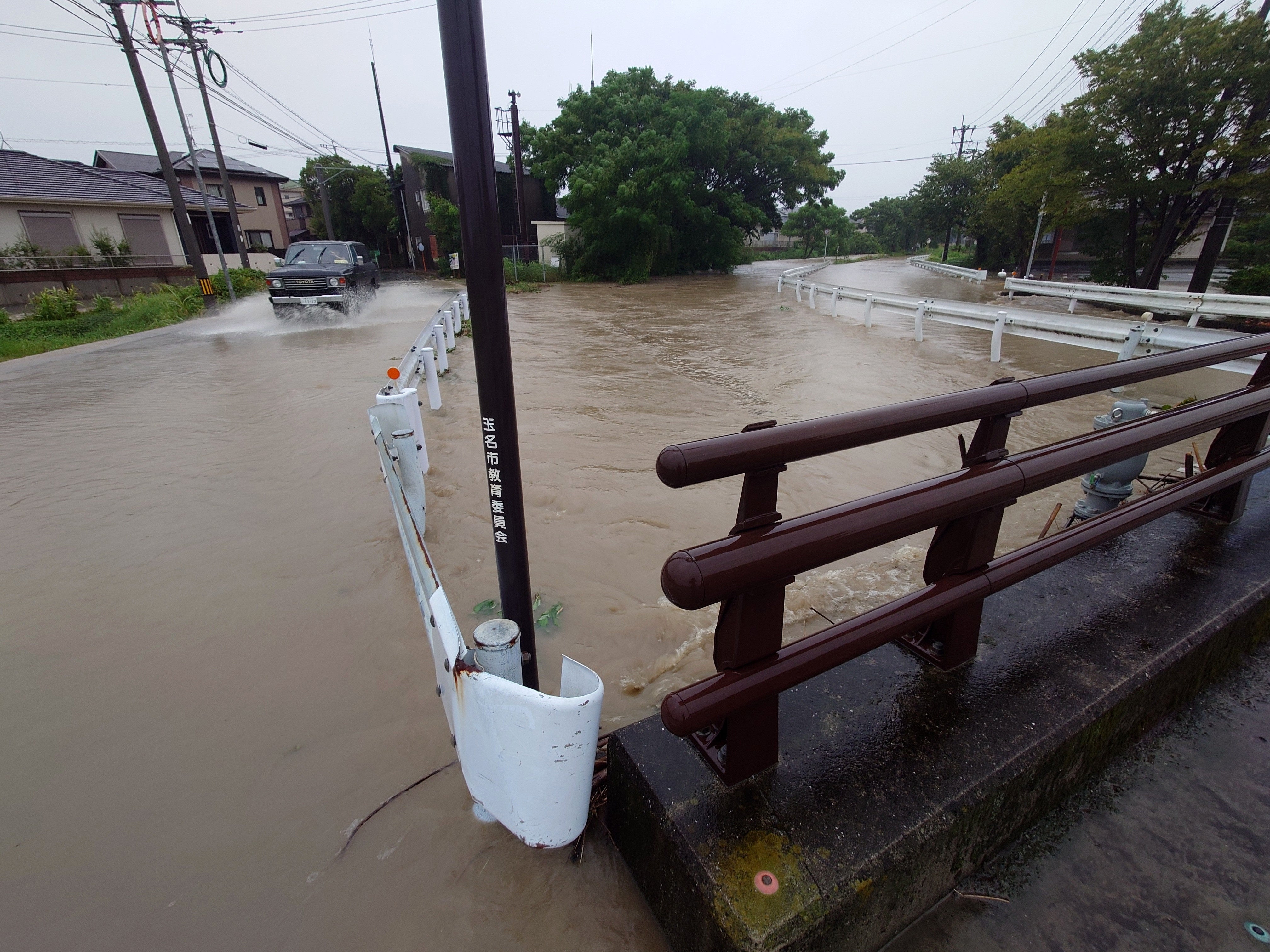 The Sakai river floods a road in Tamana, Kumamoto prefecture, Kyushu island