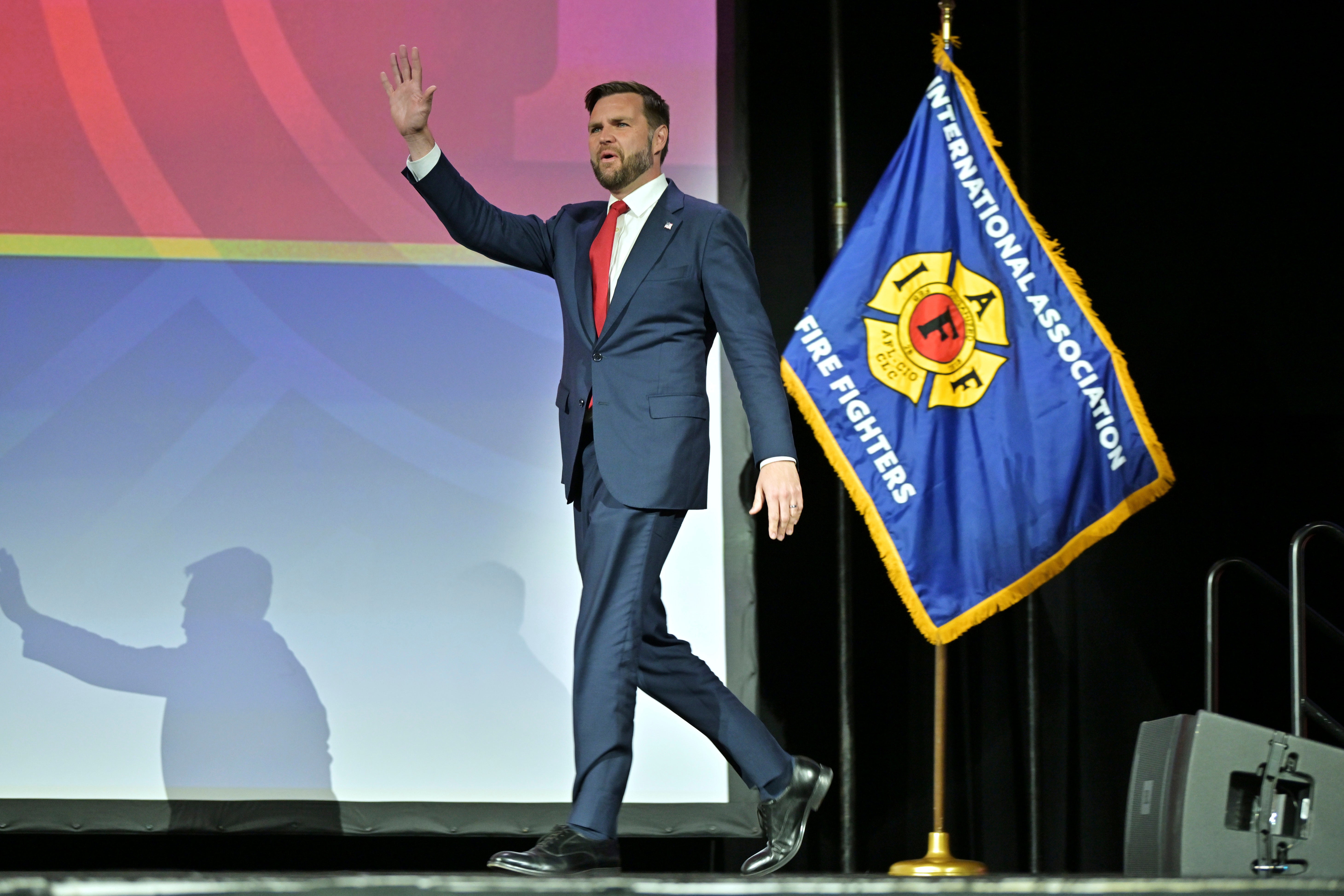 Republican vice presidential nominee Sen. JD Vance (R-Ohio) walks on stage to speak to attendees at the International Association of Fire Fighters Convention on August 29 in Boston. He was met with boos from the crowd as soon as he walked onto the stage