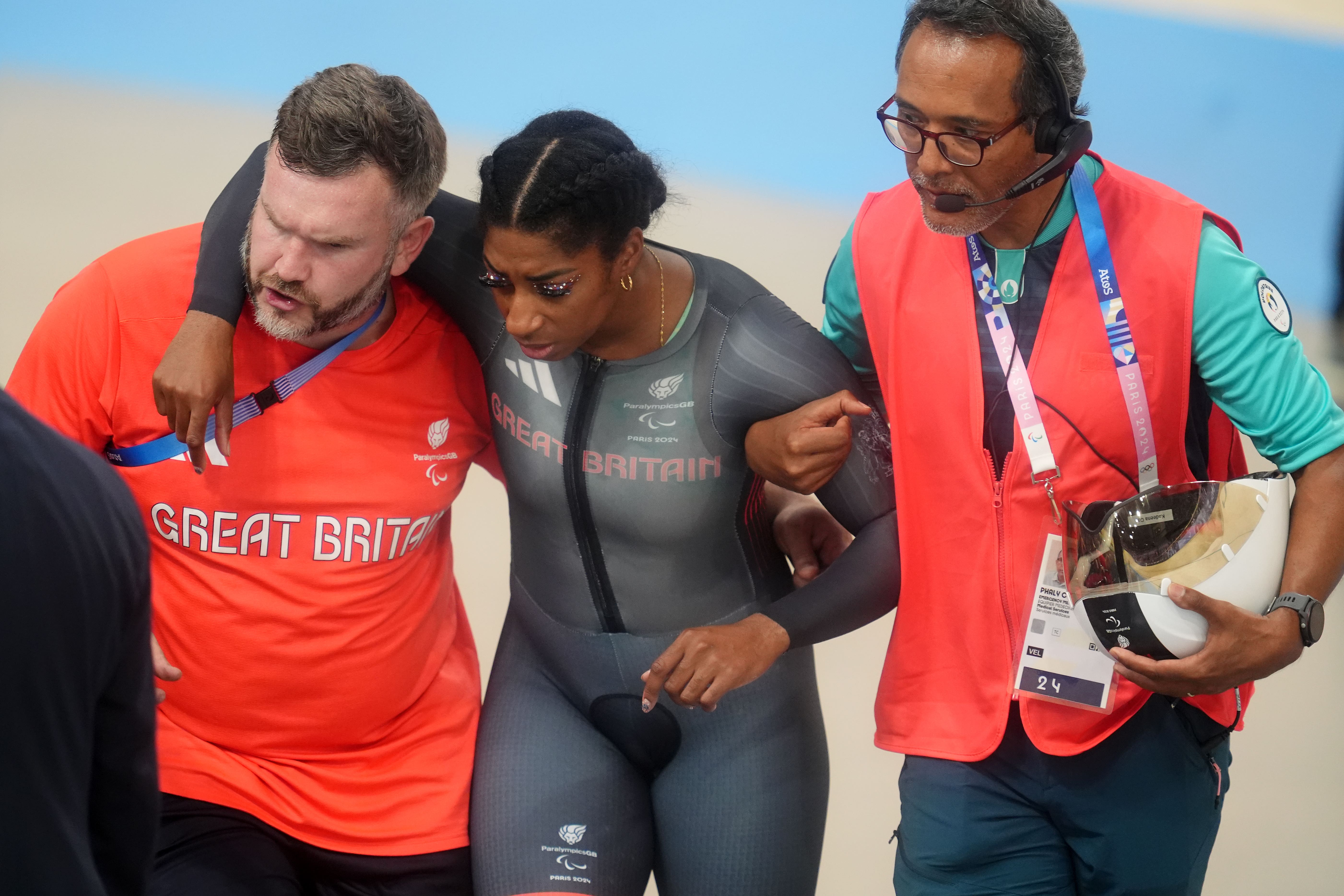 Kadeena Cox was helped from the track (Adam Davy/PA)