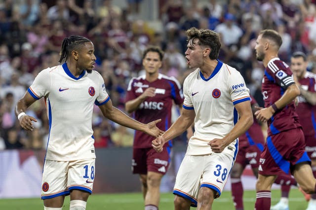 Christopher Nkunku, left, celebrates after scoring a penalty (Laurent Gillieron/Keystone via AP)