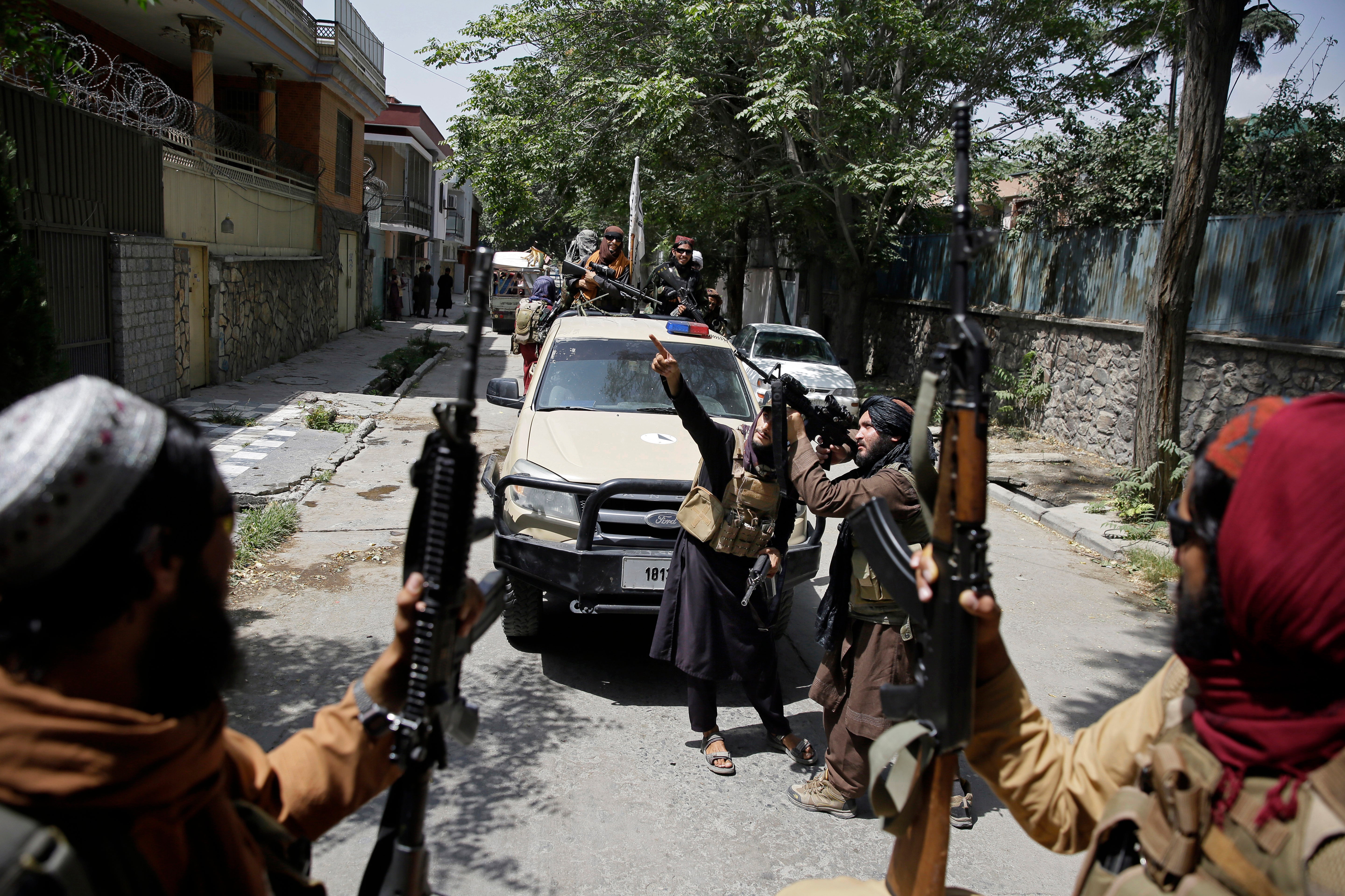 Taliban fighters patrol Kabul, Afghanistan, Thursday, Aug. 19, 2021