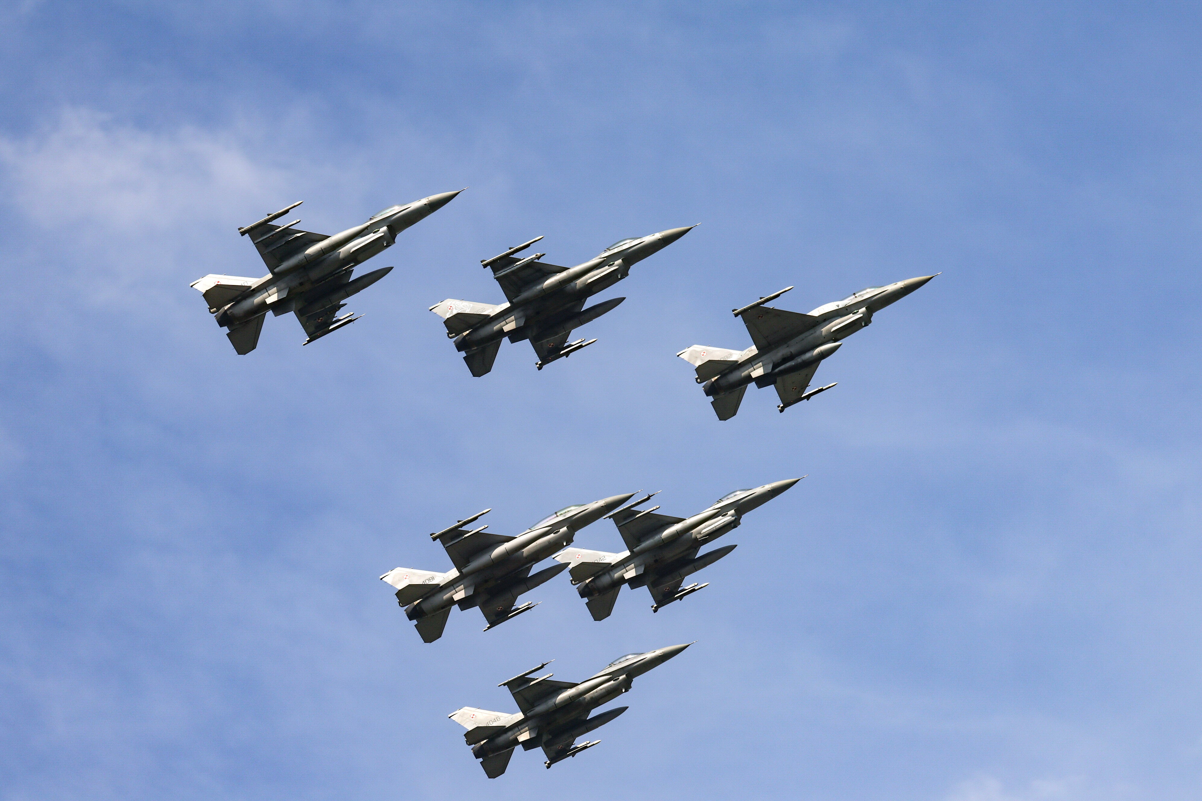 Polish Air Force’s F-16 fighter jets perform a flyover as part of the military parade during the Polish Armed Forces Day in Warsaw, Poland, 15 August 2024