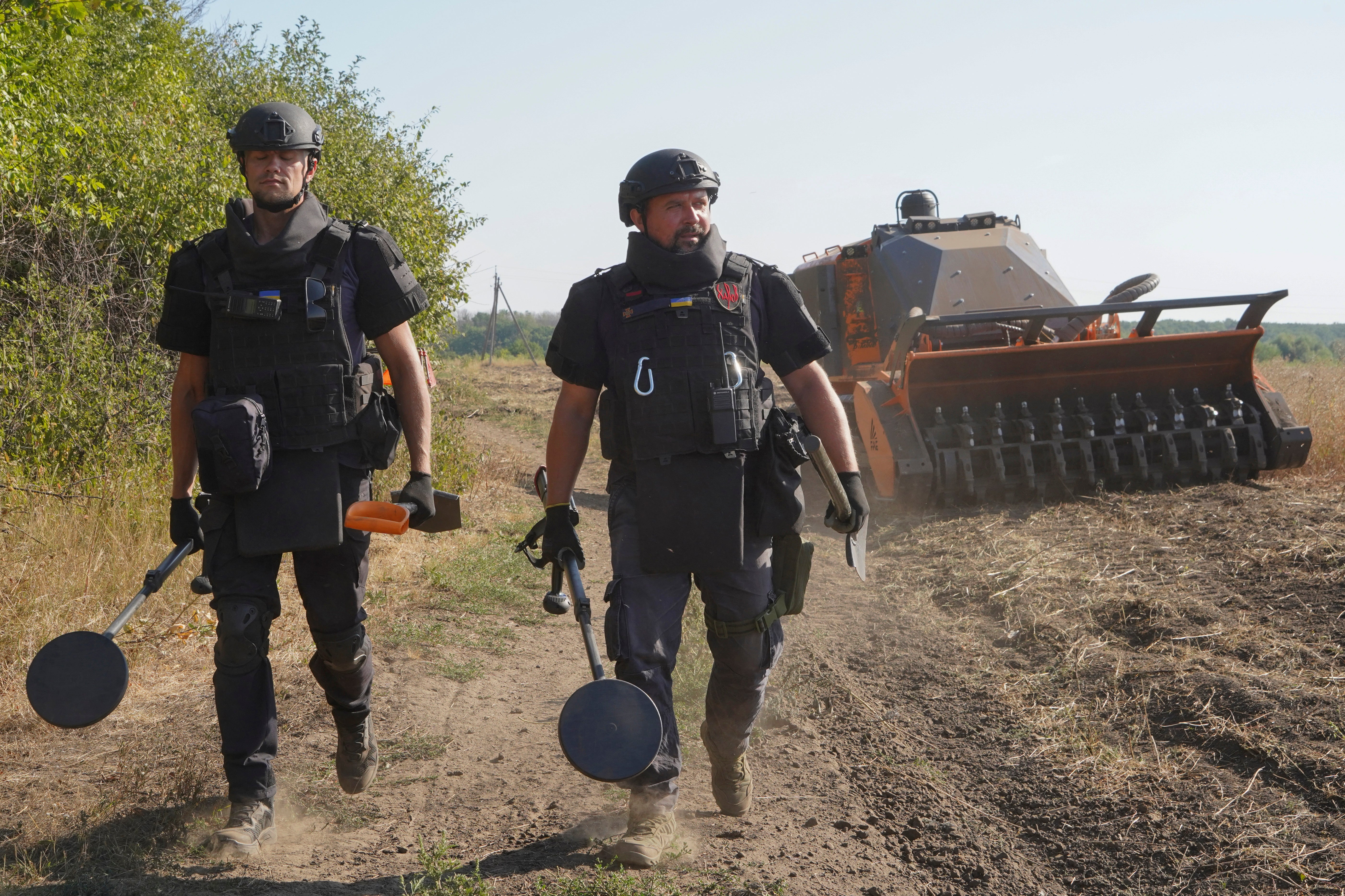 Ukrainian sappers demine farmers’ fields after heavy battles with the Russian troops in Kharkiv region, Ukraine, Thursday, 29 August 2024