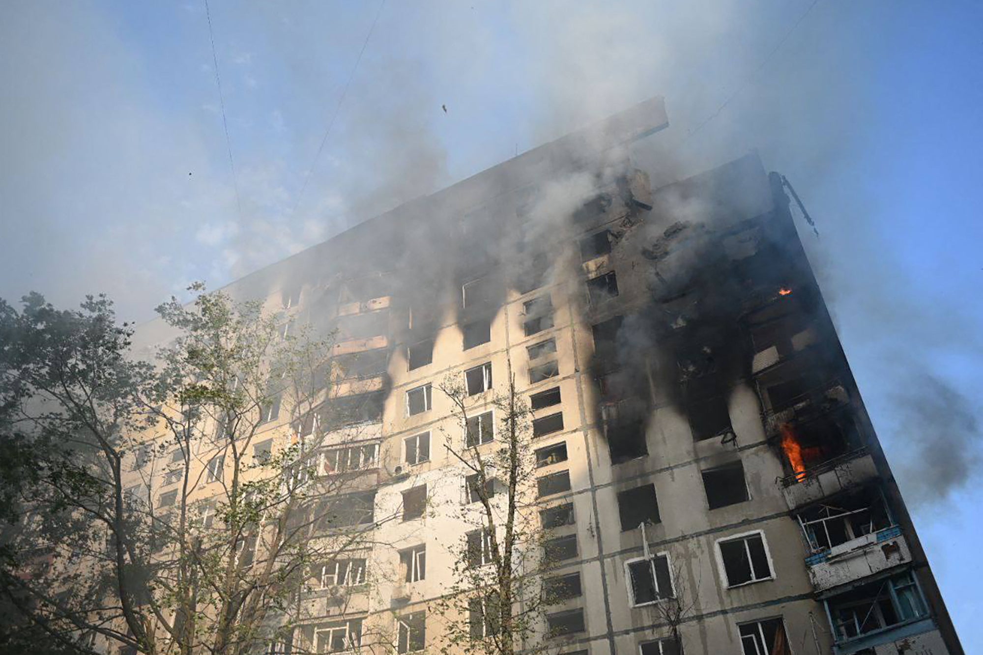 The top corner of a multistorey building in Kharkiv is seen destroyed after a Russian missile attack