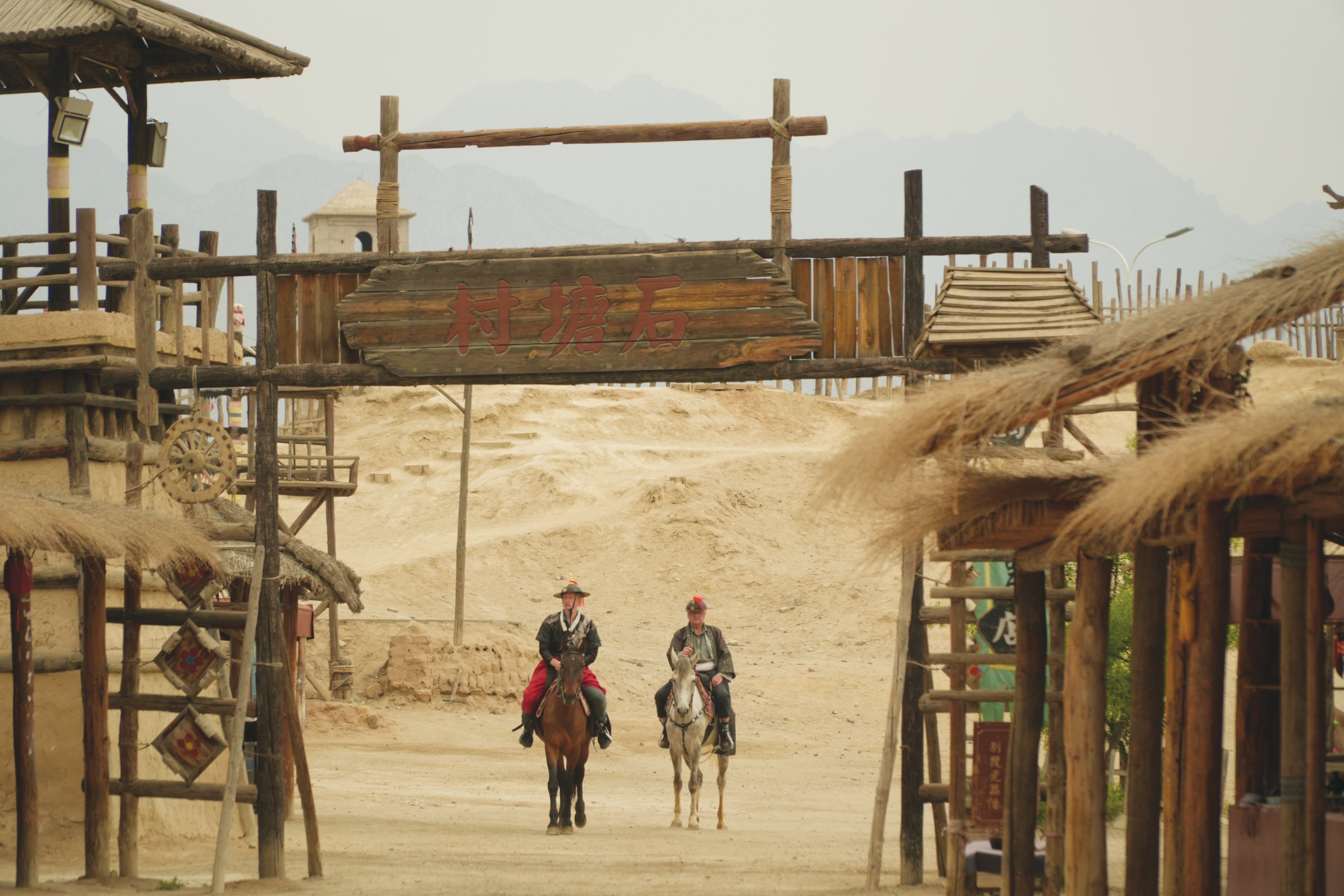 Stanley Johnson and his son Max Johnson wear costumes during a role-playing game at a film production base in China’s Ningxia Hui autonomous region