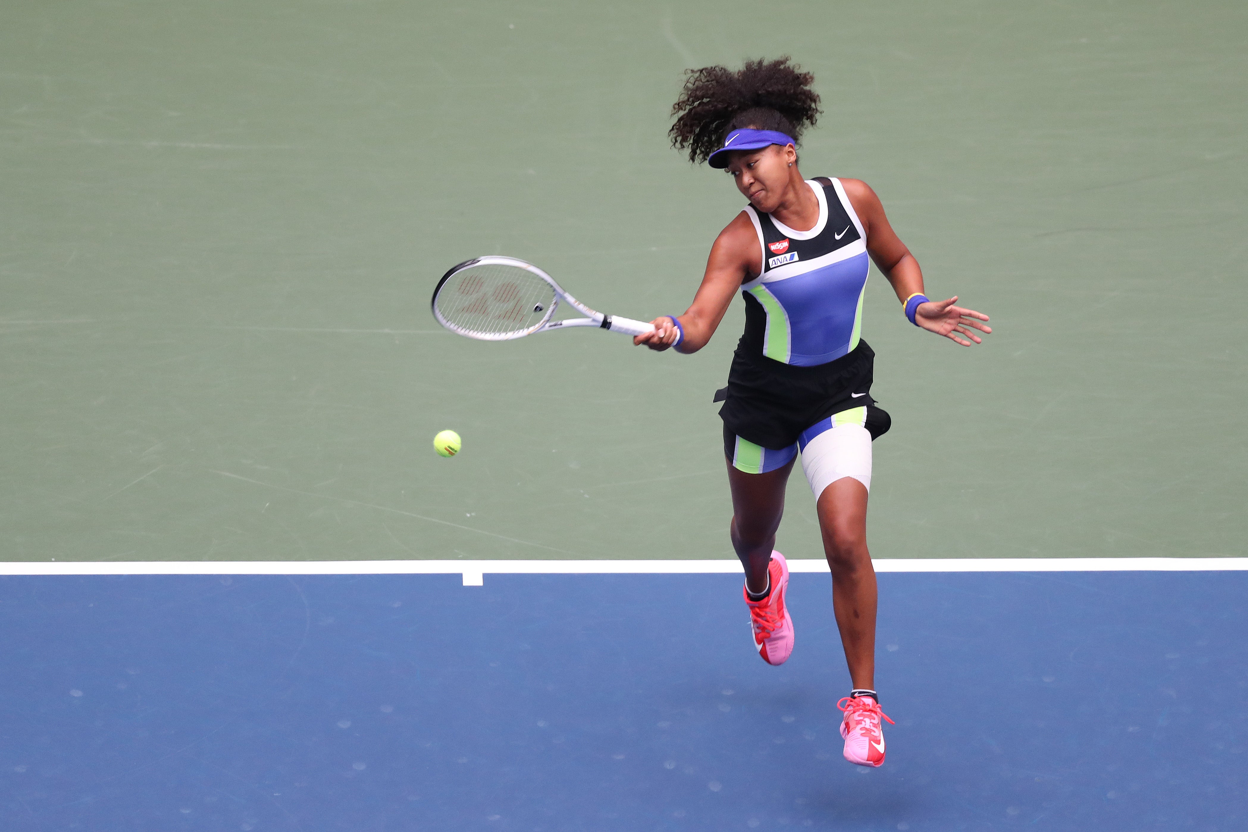 Naomi Osaka performs in a colorful Nike outfit during the women's singles final in 2020