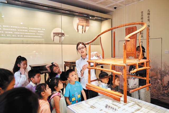 <p>A wooden chair on display at the Summer Palace Museum in Beijing</p>