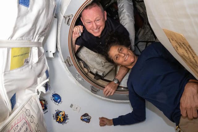 <p>Nasa’s Boeing Crew Flight Test astronauts (from top) Butch Wilmore and Suni Williams pose on June 13, 2024 for a portrait inside the vestibule between the forward port on the International Space Station’s Harmony module and Boeing’s Starliner spacecraft. </p>