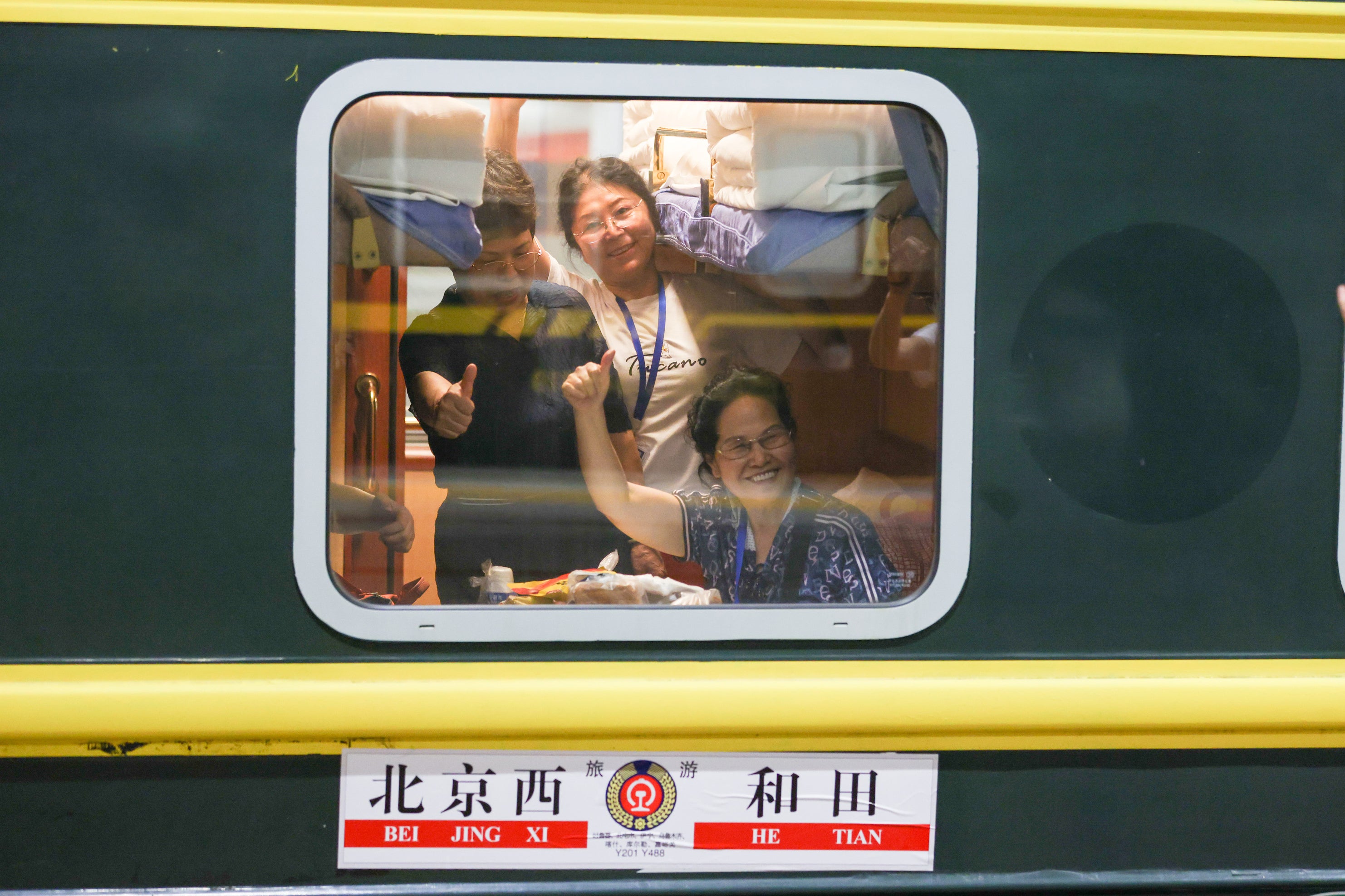 A tourist train departs Beijing for the Xinjiang Uygur autonomous region in July