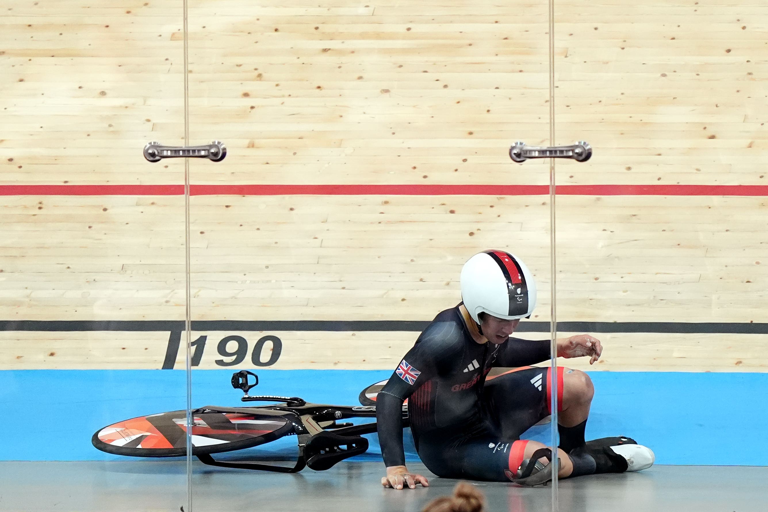 Great Britain’s Archie Atkinson crashes during the men’s C4 4000m individual pursuit final (Zac Goodwin/PA)