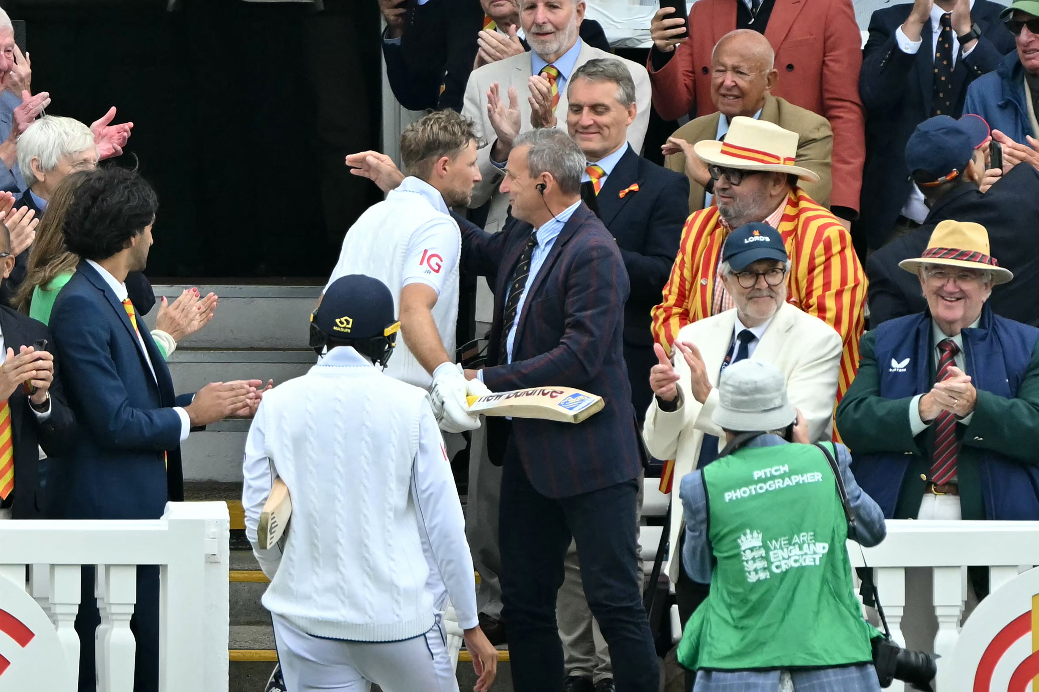 Joe Root was congratulated by his father Matt as he headed back to the pavilion