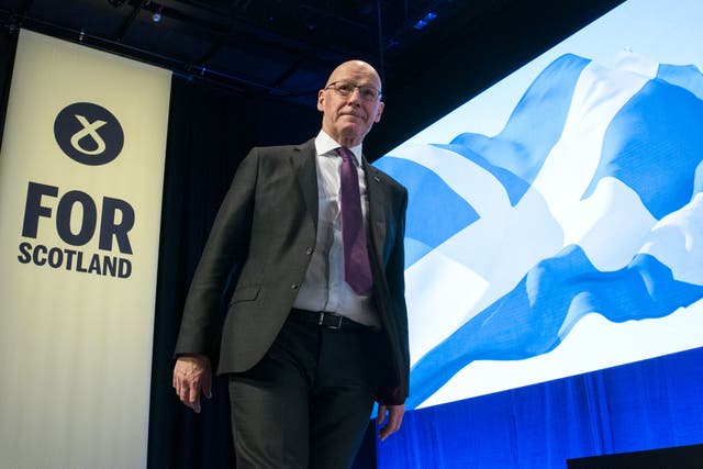 First Minister John Swinney will set out how the Scottish Government will have to work ‘harder and smarter’ as a result of UK Government ‘cuts’ (Jane Barlow/PA)