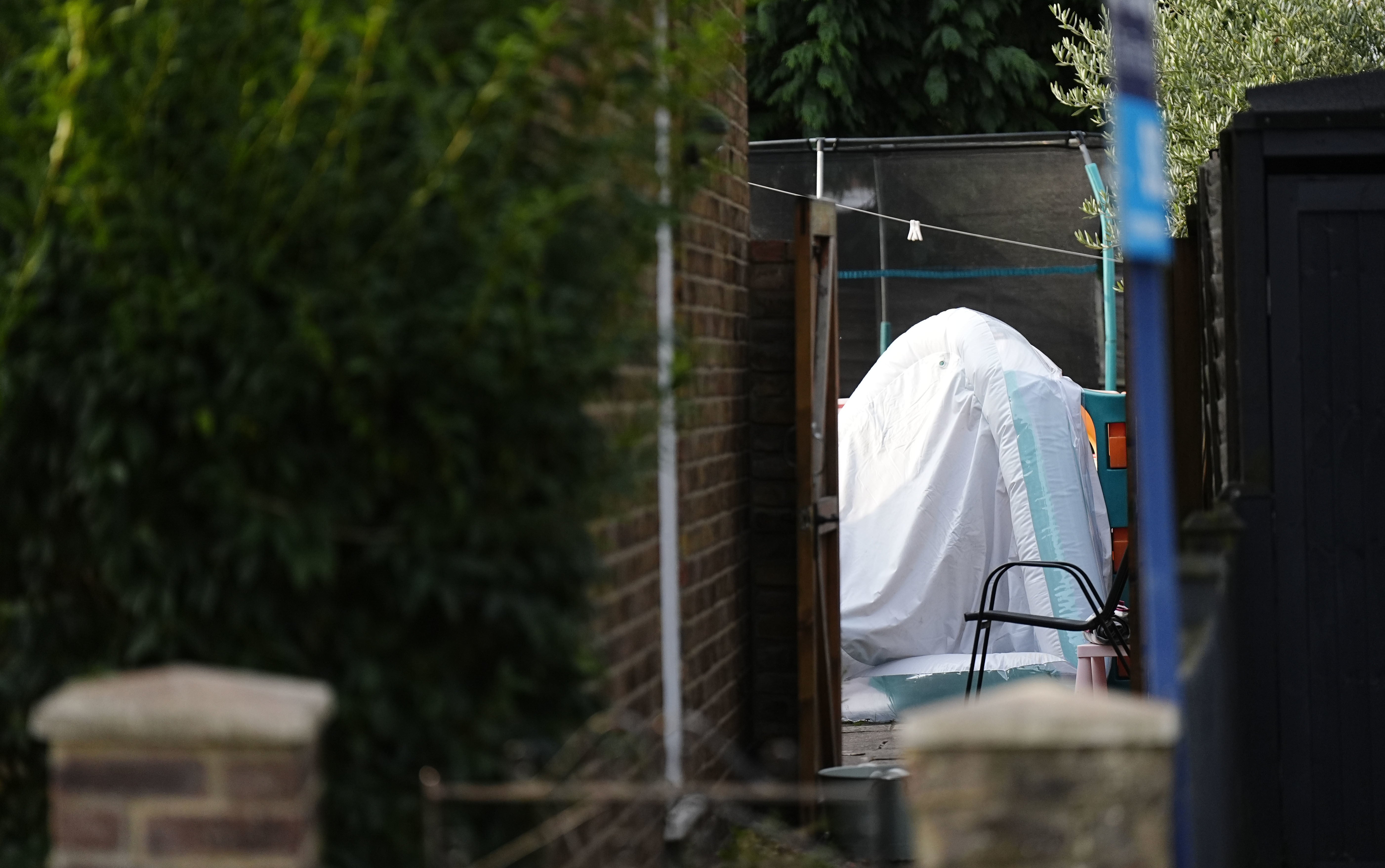Three children and man found dead in Surrey house | The Independent